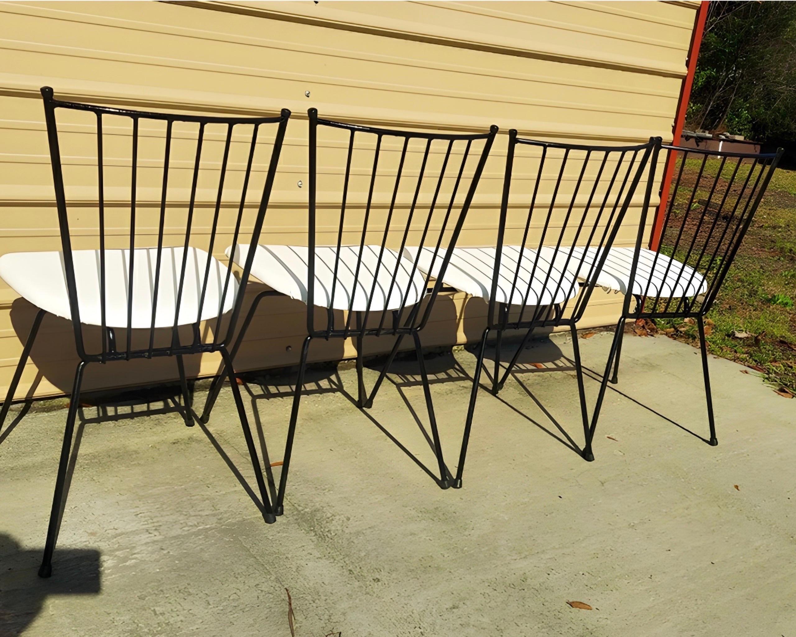 A set of 4 Reilly-Wolff Associates 1950’s iron spindle fan back kitchen/side chairs

A very nice pair of spindle fan back side chairs. These are dining chair height and can also be used as a nice accent chair anywhere. Circa 1950-60. The iron chair