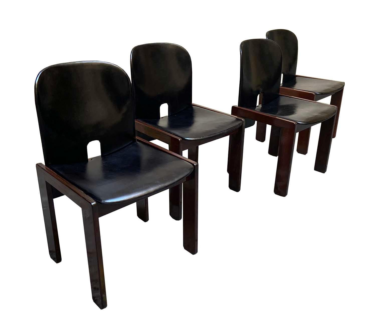 Set of four chairs model 121 designed by Afra & Tobia Scarpa in 1965. wood structure and black leather.
