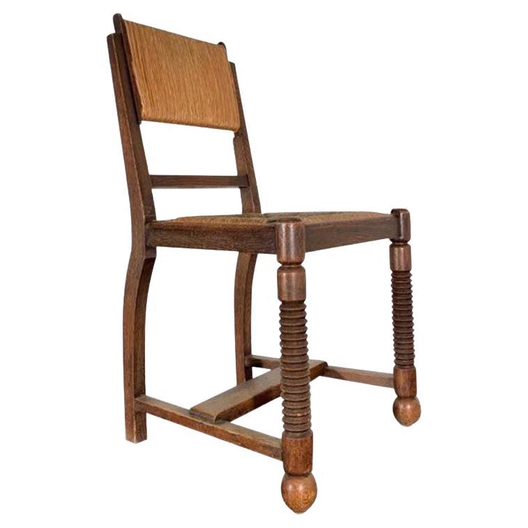 Four Chairs Oak and Straw by Charles Dudouyt