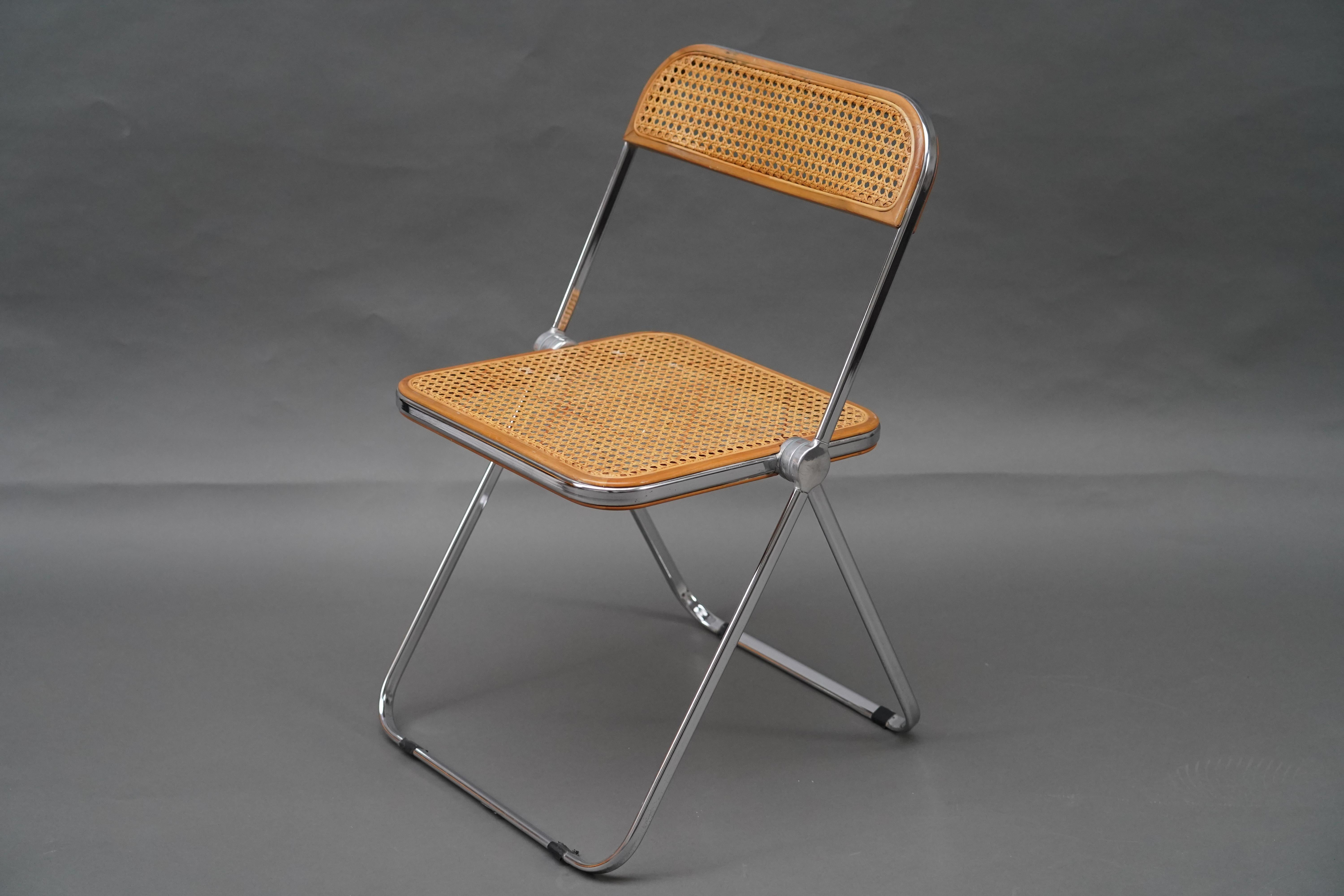 Set of 4 “Plia” model folding chairs from the 1960s with Viennese canework and chrome tubes.
These iconic Italian chairs were designed by Giancarlo Piretti for Castelli in 1967.

Giancarlo Piretti was born in Bologna in 1940. He attended the