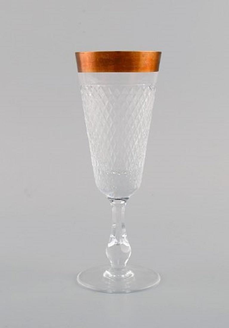 Four champagne glasses in mouth-blown crystal glass with gold edge, France, 1930s.
Measures: 16.5 x 6.2 cm.
In excellent condition.