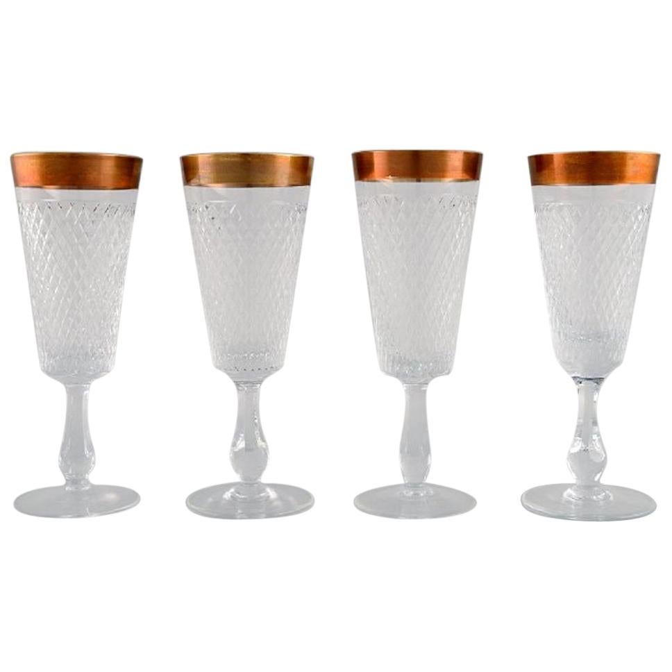 Four Champagne Glasses in Mouth-Blown Crystal Glass with Gold Edge, France 1930s