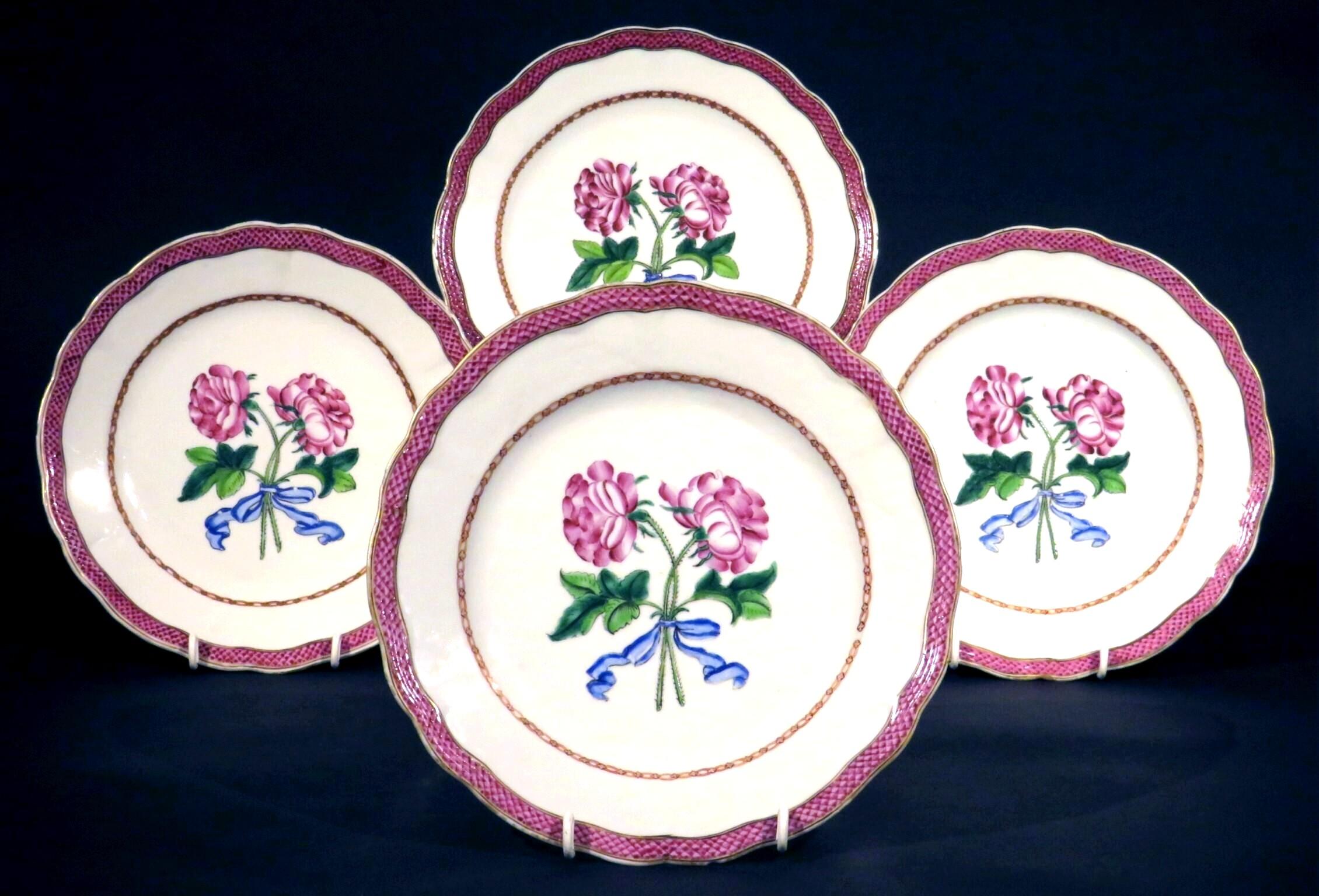 A very attractive group of four 18th century Chinese export porcelain botanical plates apparently made for the French market, circa 1775.
Each plate having a scalloped rim banded with enameled diaper motifs, the shallow central field decorated with
