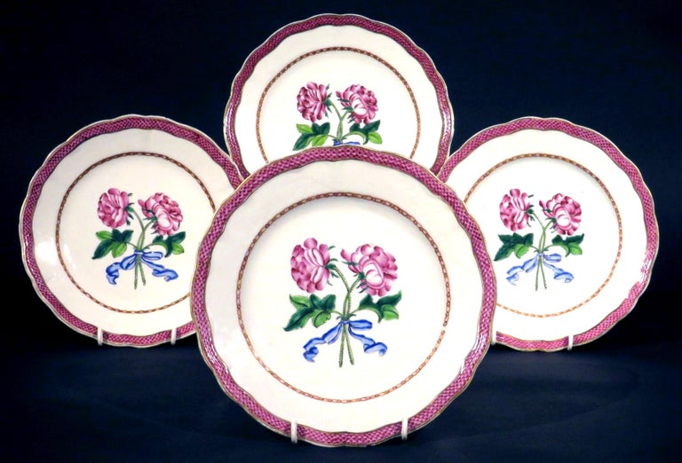 A very attractive grouping of four 18th century Chinese export porcelain botanical plates apparently made for the French market, circa 1775.
Each plate having a scalloped rim banded with enameled diaper motifs, the shallow central field decorated