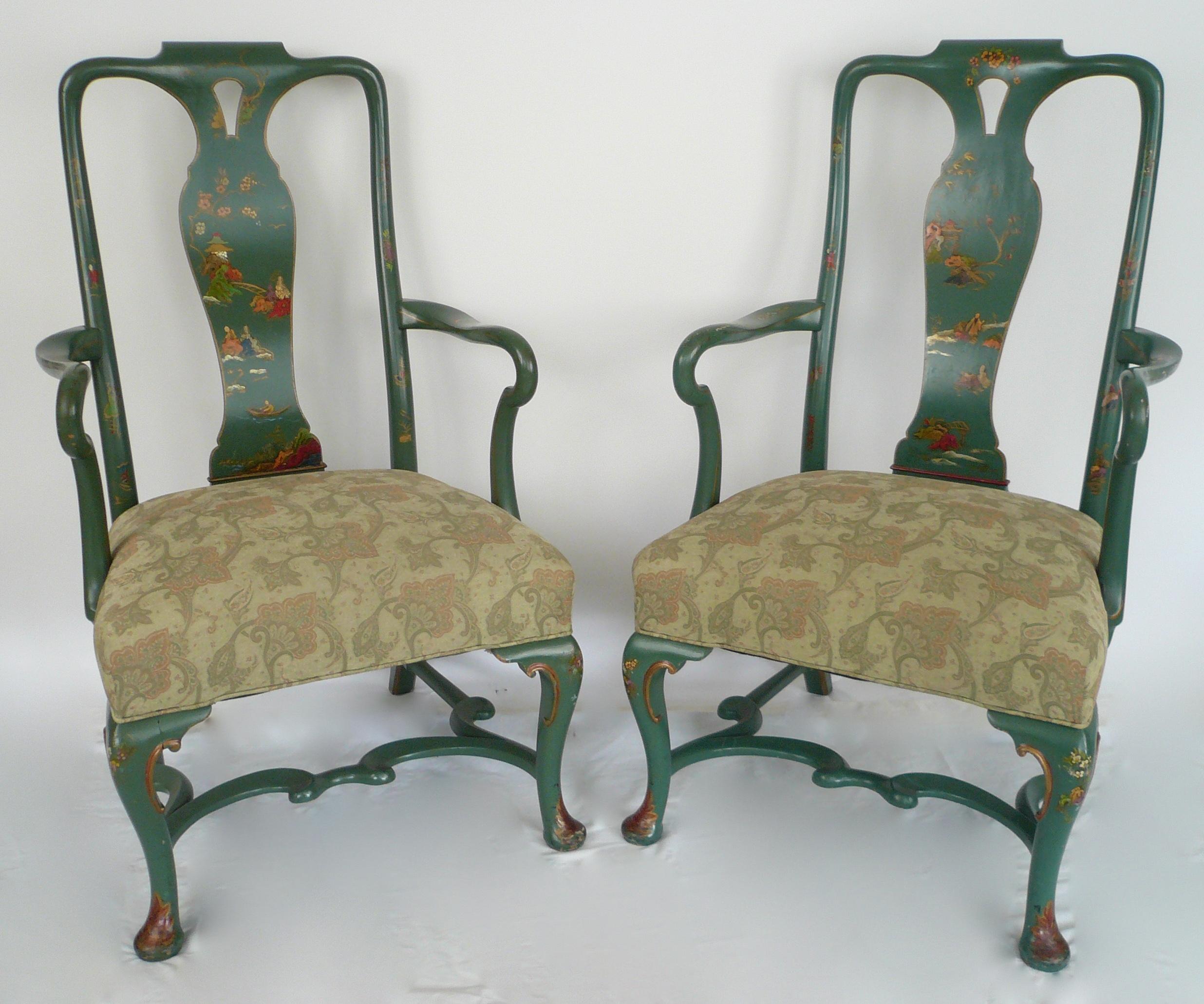 These substantially proportioned chairs feature hand painted chinoiserie motifs on a green ground.