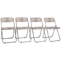 Four Chrome Folding Chairs