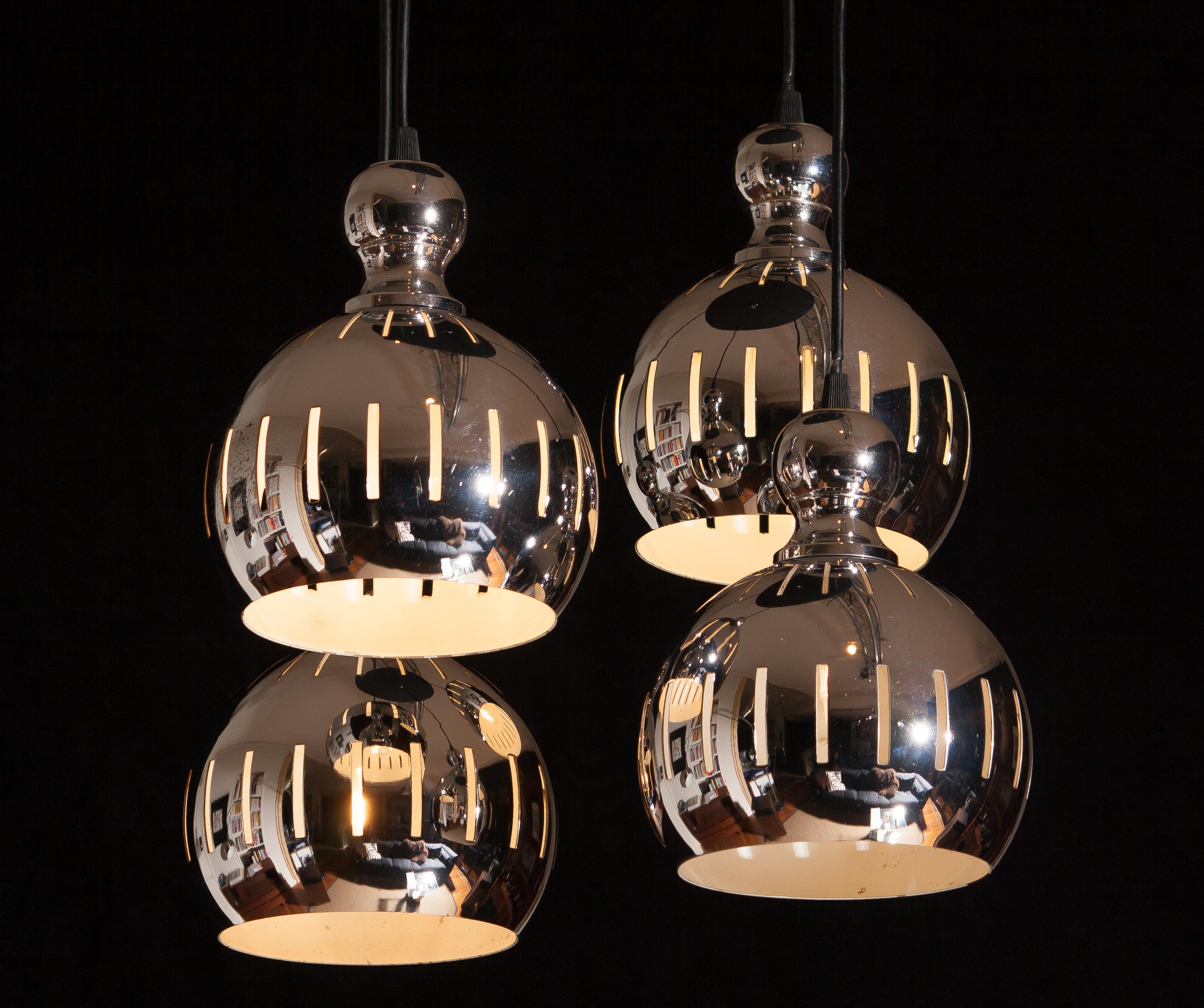 Beautiful chromed sphere shaped metal chandelier by Esperia, Italy.
The chandelier is technically 100%. 
Bulb size: E 26 / 27 for 110 / 230 volts.
Period 1970.

We offer free service to adjust the cables in length you wish. 

The dimension