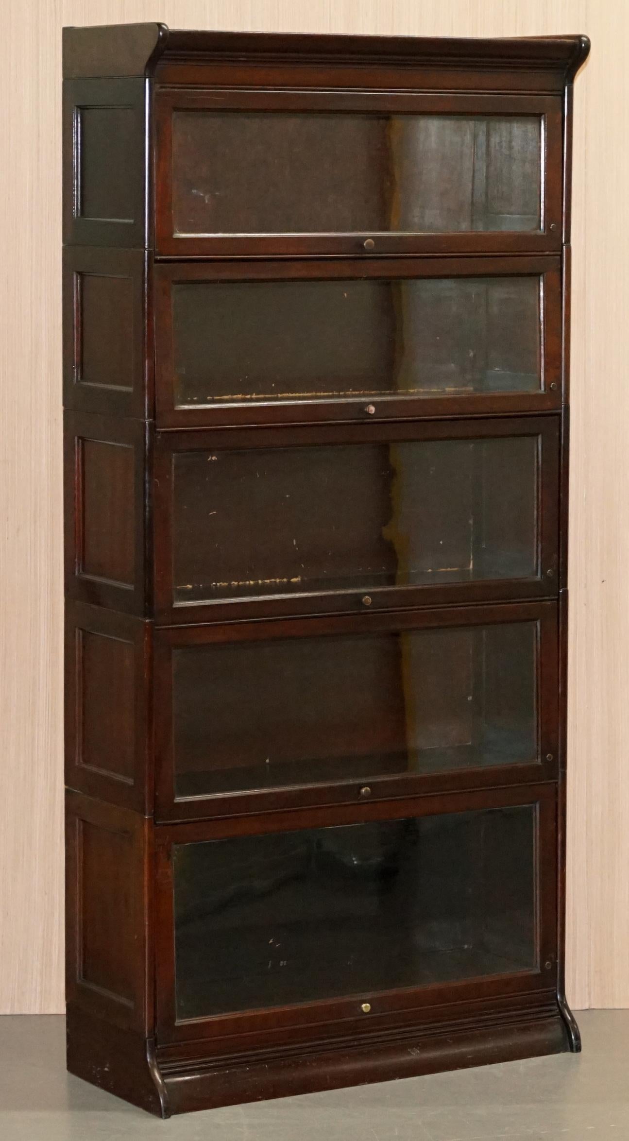 We are delighted to offer for sale this very rare suite of four Legal Library stacking modular bookcases by Grand Rapids chair and bookcase Co. circa 1880 in panelled mahogany

These are as rare as they come, you will see plenty of the Globe