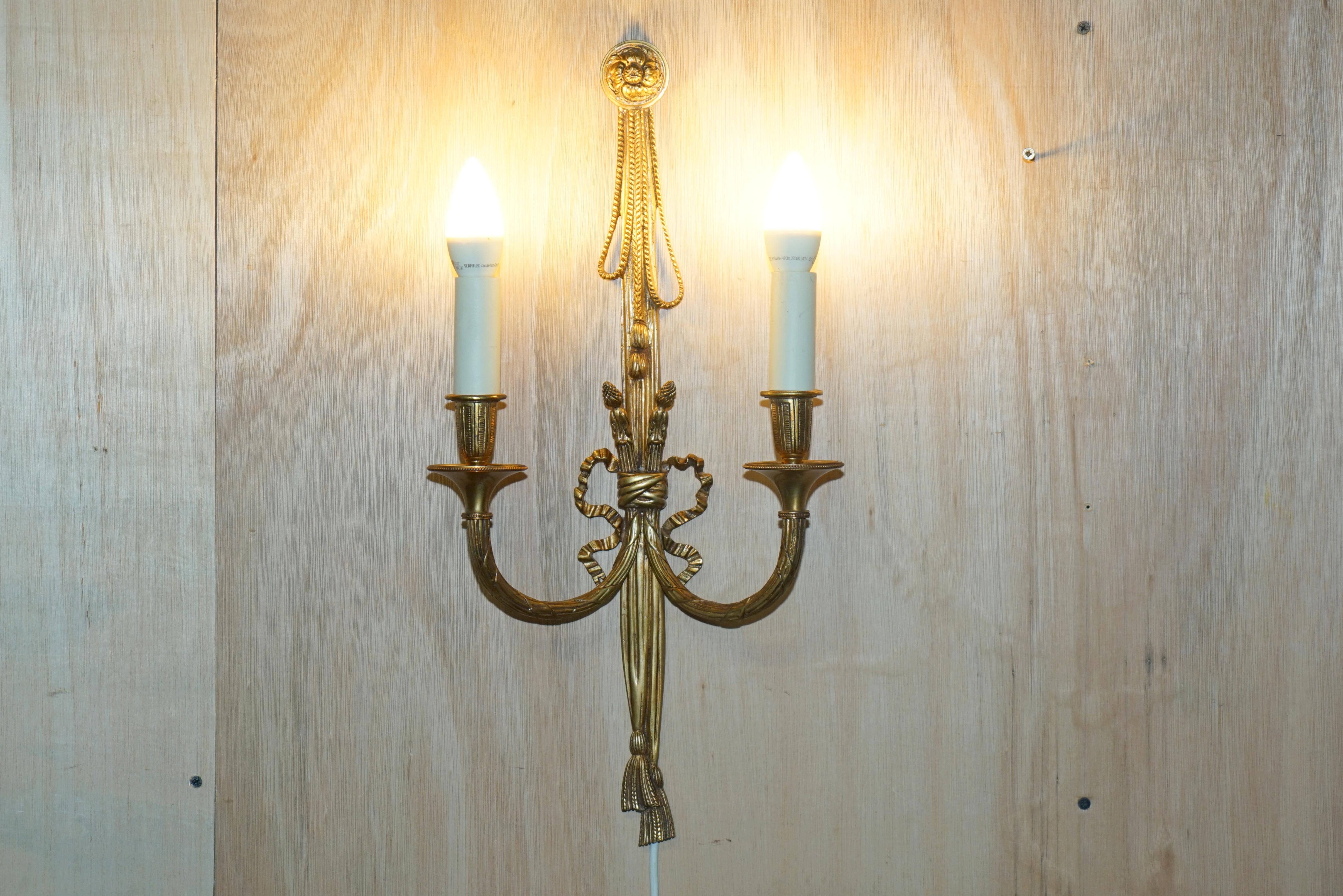 We are delighted to offer for sale this stunning suite of four large antique circa 1920-1940 Gilt Bronze wall sconces which are part of a larger set 

These sconces are part of a set as mentioned, I have these four larger example, four smaller