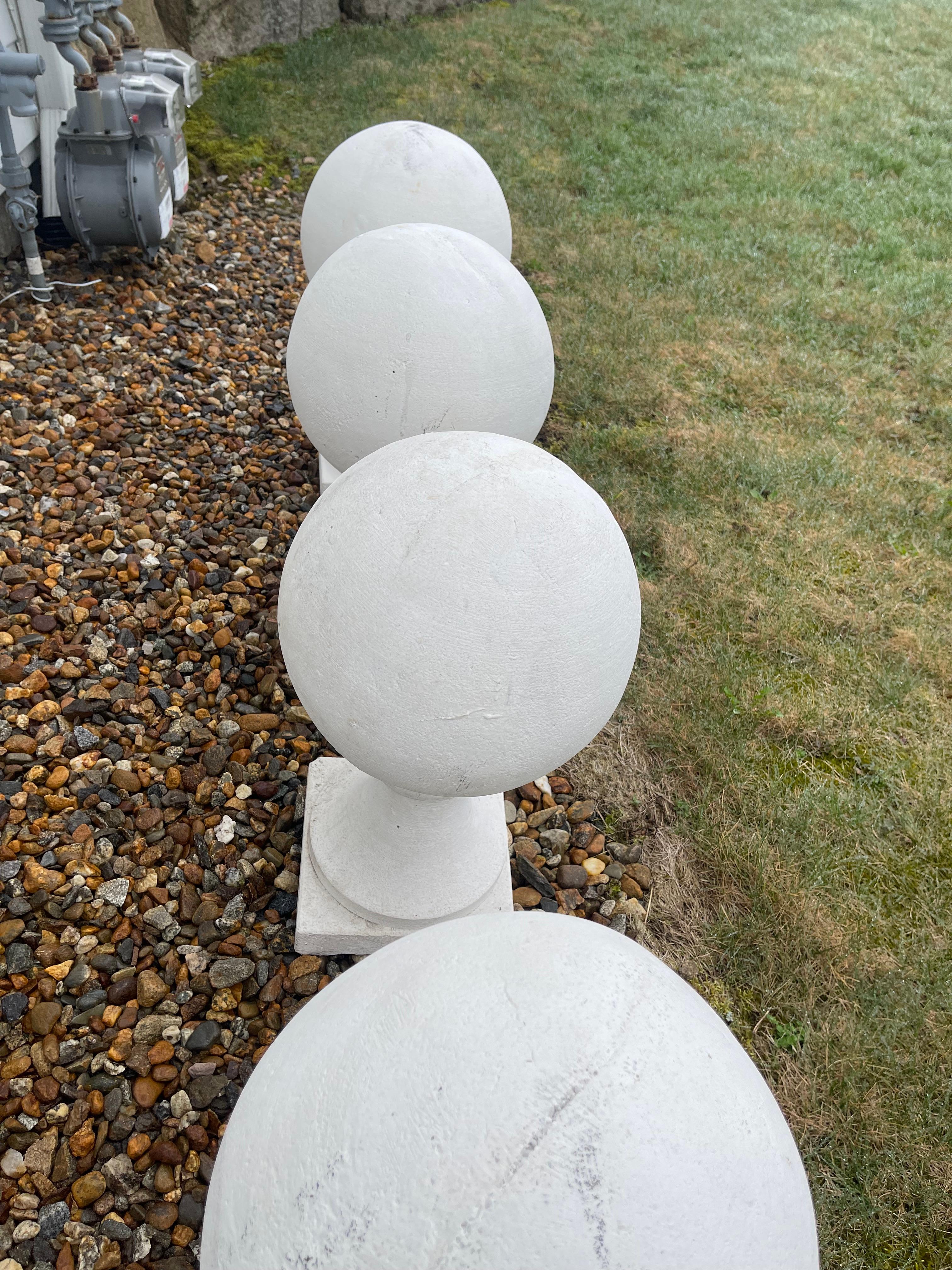 20th Century Four Classic White Cement Ball Finials on Square Base from a North Shore Estate