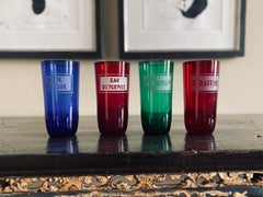 Four Colored Glass Apothecary Jars with Etched Inscription