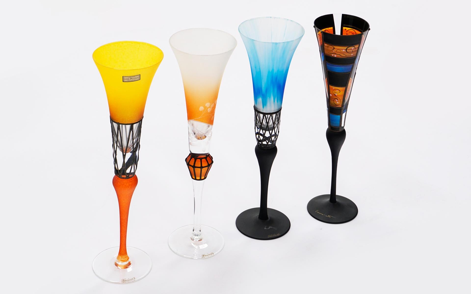 Set of four art glass champagne flutes from the Czech Republic. Three are marked Fantasy and one has a different mark as seen in the photos. That glass is slightly shorter than the other three as you can see if you look closely at the photos. All