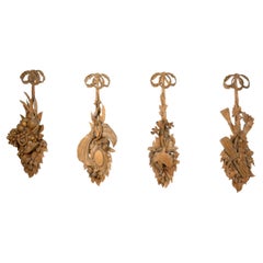Four Continental Wood Carved Panels of the "Four Seasons" with Ribbon Hangers
