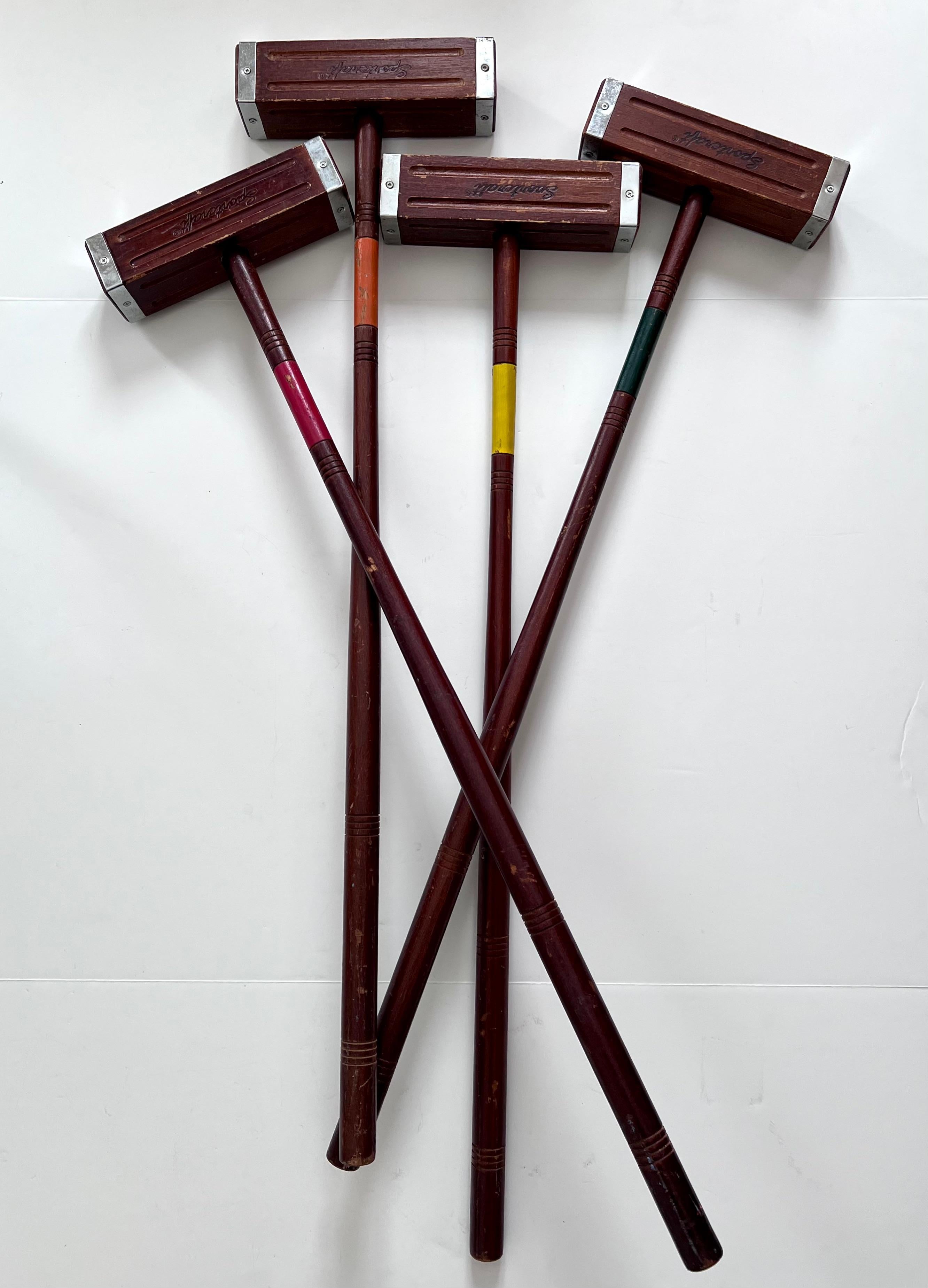 A set of four wooden croquet mallets - beautifully made an lovely style. These can work for your game or be used as a decorative piece for your game room or 'Ralph Lauren' style setting.. a unique set as the mallet head is square and not round. In