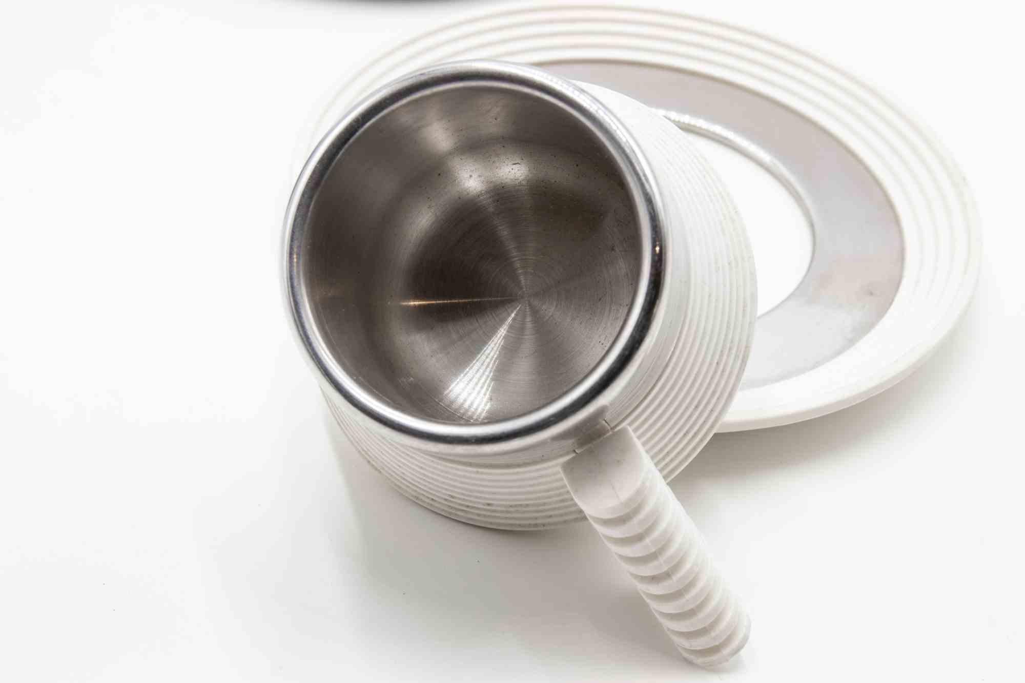 Acciaio Quattro tazze con piatti di Carlo Giannini, anni '70 in vendita