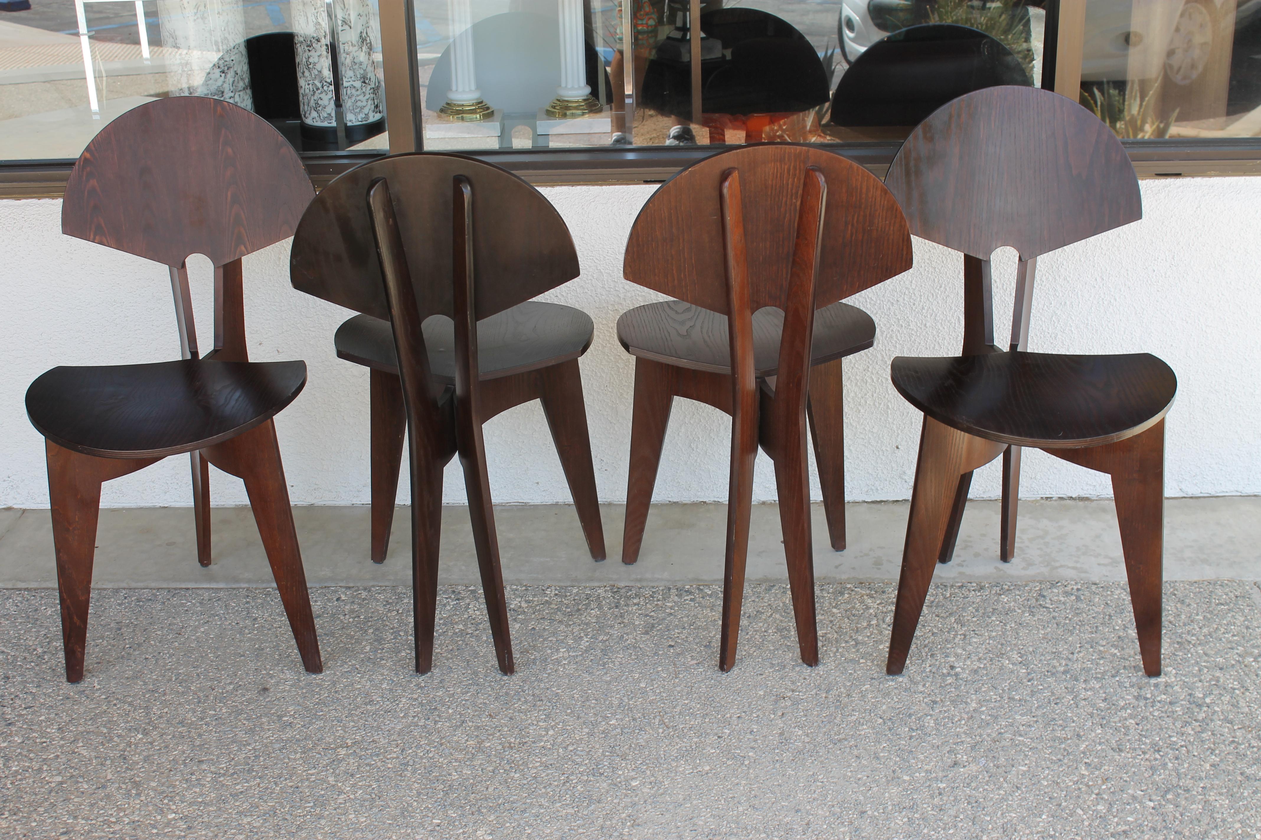 Four studio wood chairs in a ginkgo leaf or fan pattern. Each chair measures 16.5” wide, 20.5” deep and 33” high. Seat height is 17.5”. We believe the wood to be ash and they are extremely light weight.
 