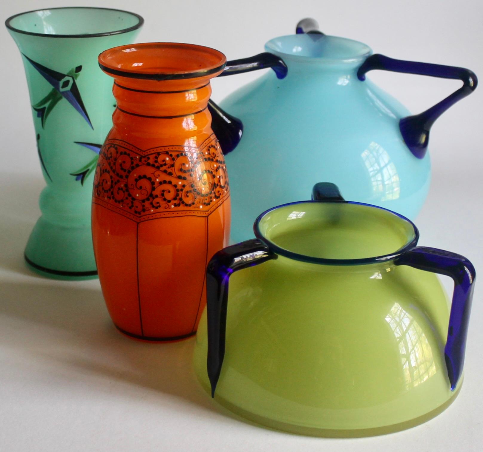 Offering a group of four very different Czech Tango vases. Blue handled vase: 5