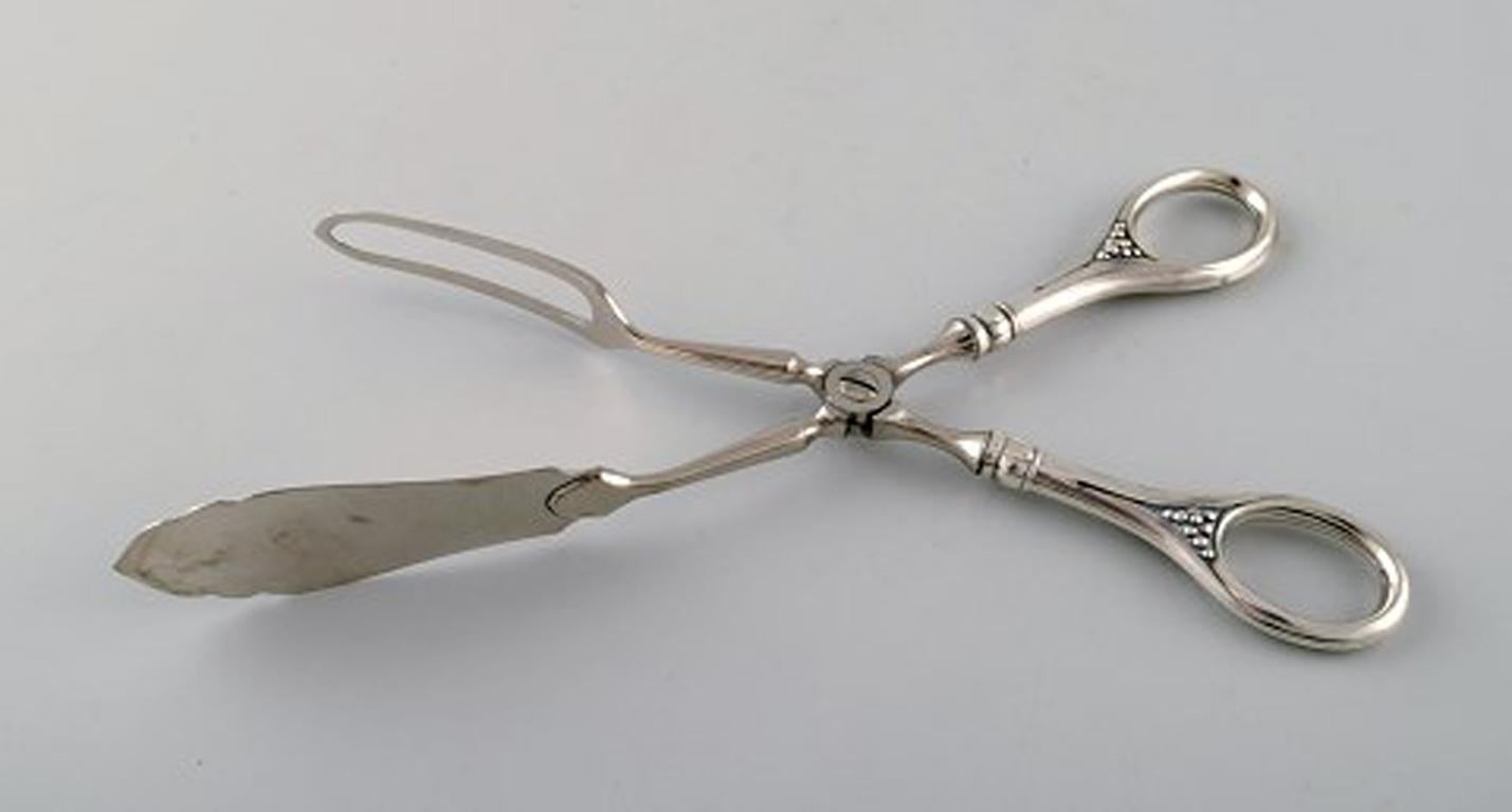 20th Century Four Danish and European scissors and tongs in silver, Grann & Laglye 830s.  For Sale