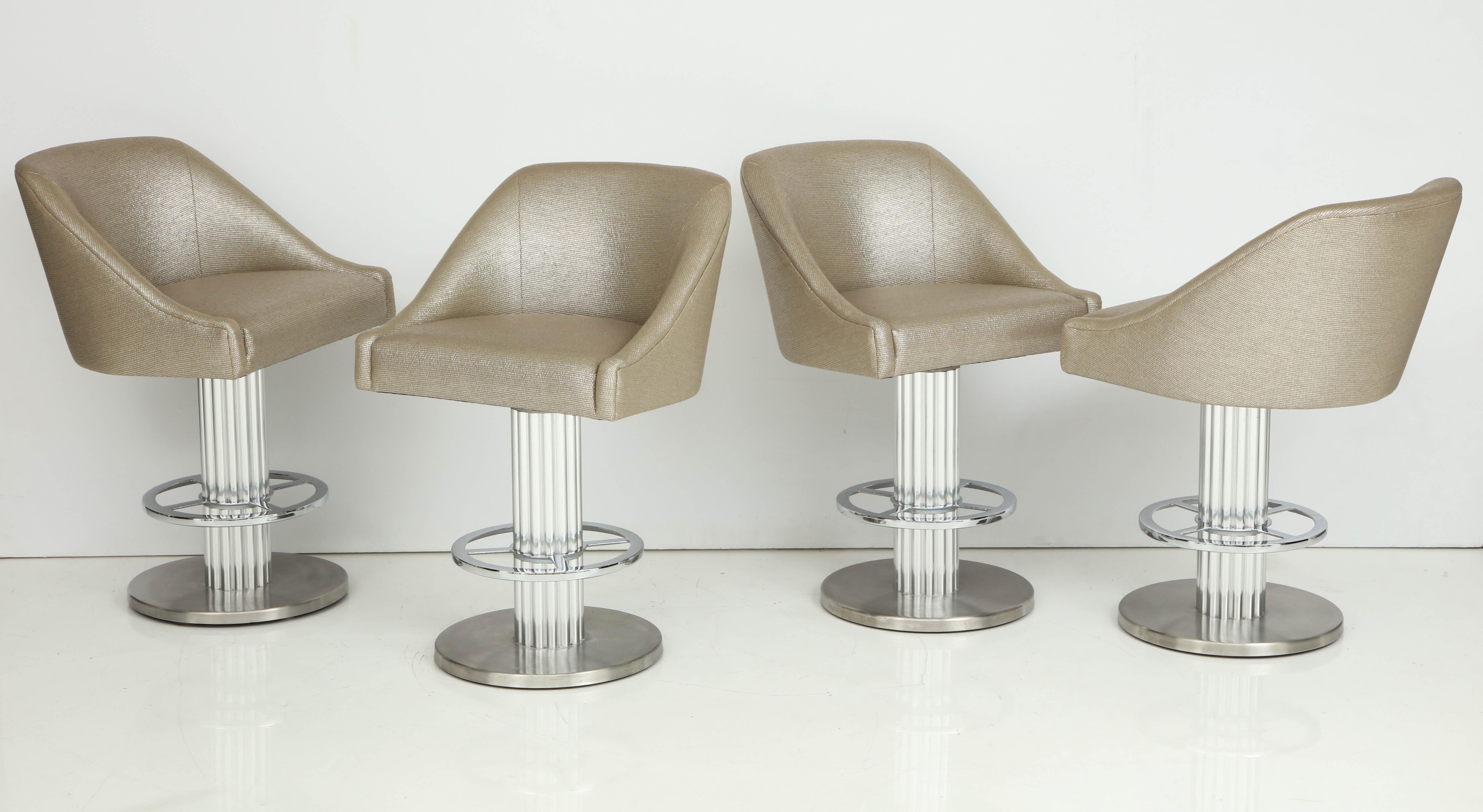 Wonderful set of four 1980's designs for Leisure bar stools.
The bar stools are polished and brushed nickel over heavy steel frames.
They have been newly reupholstered in a luxurious metallic zinc textiles fabric by Romo.