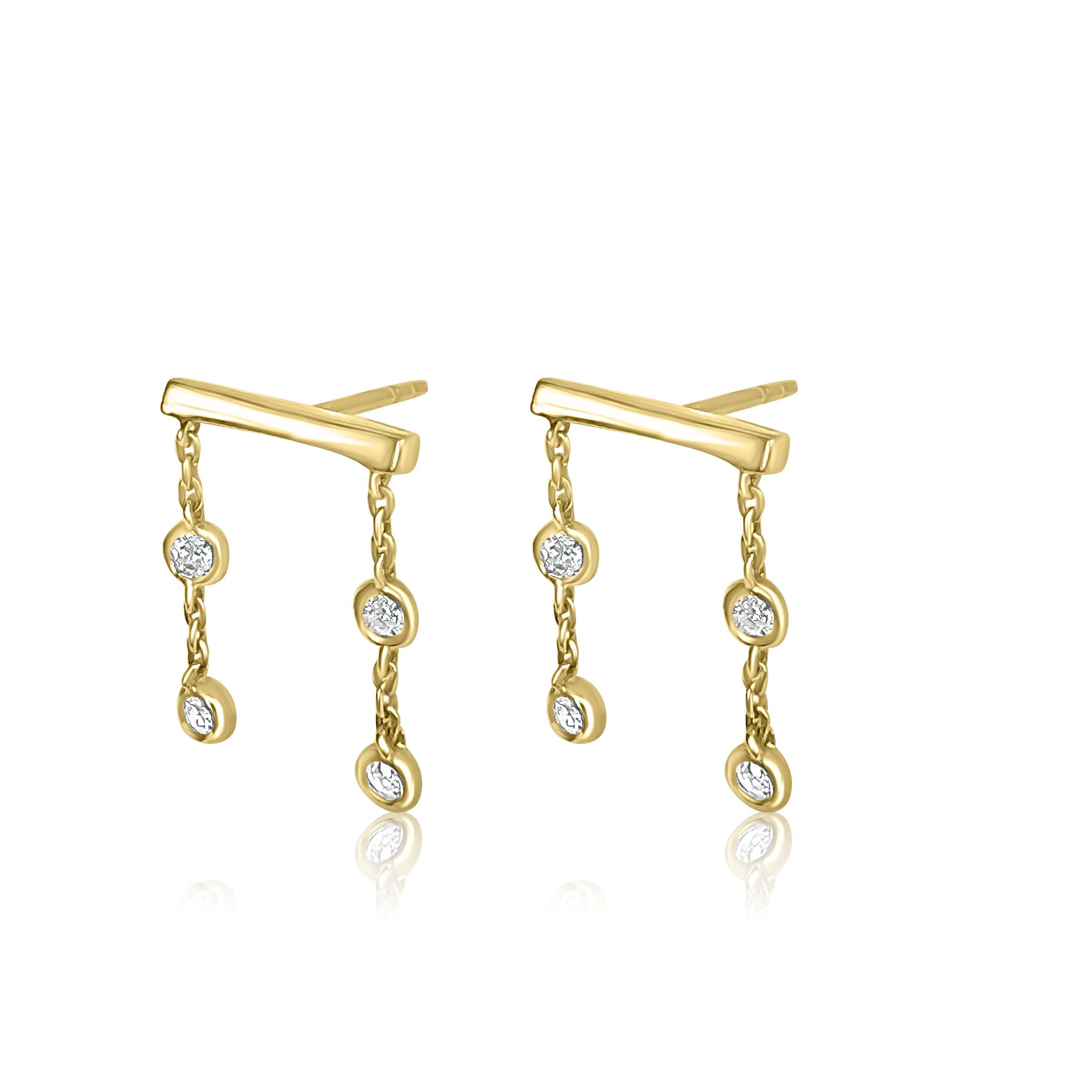 Balance and scale harmoniously coexist in these simple and versatile studs. The simple staple shape is accentuated with a chain and four dangling bezel-set diamonds on each earring and is a creative take on the 4:4 roll also called the “Square Pair