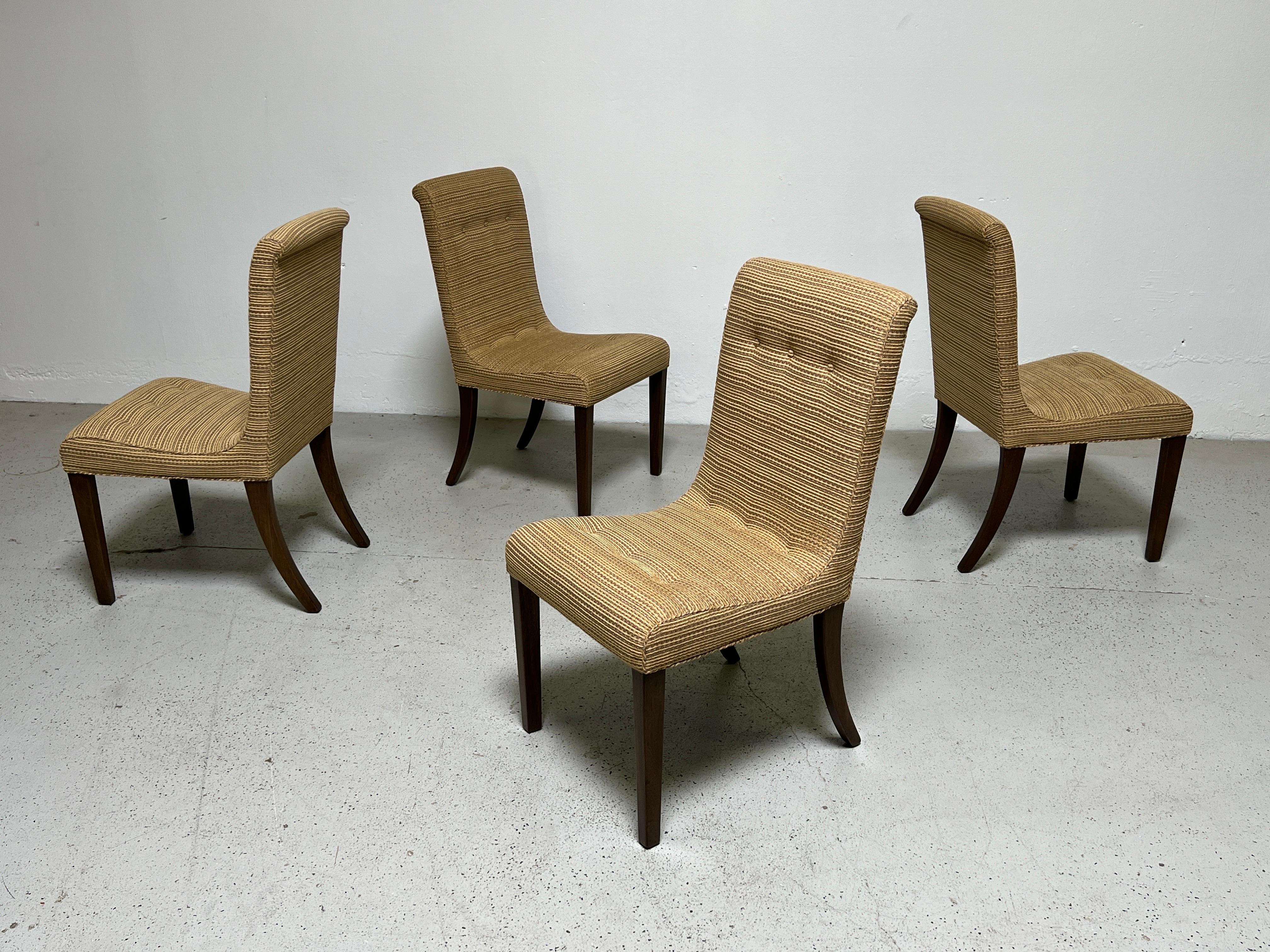A set of four Edward Wormley for Dunbar high back dining chairs with mahogany bases. Fully restored and reupholstered.