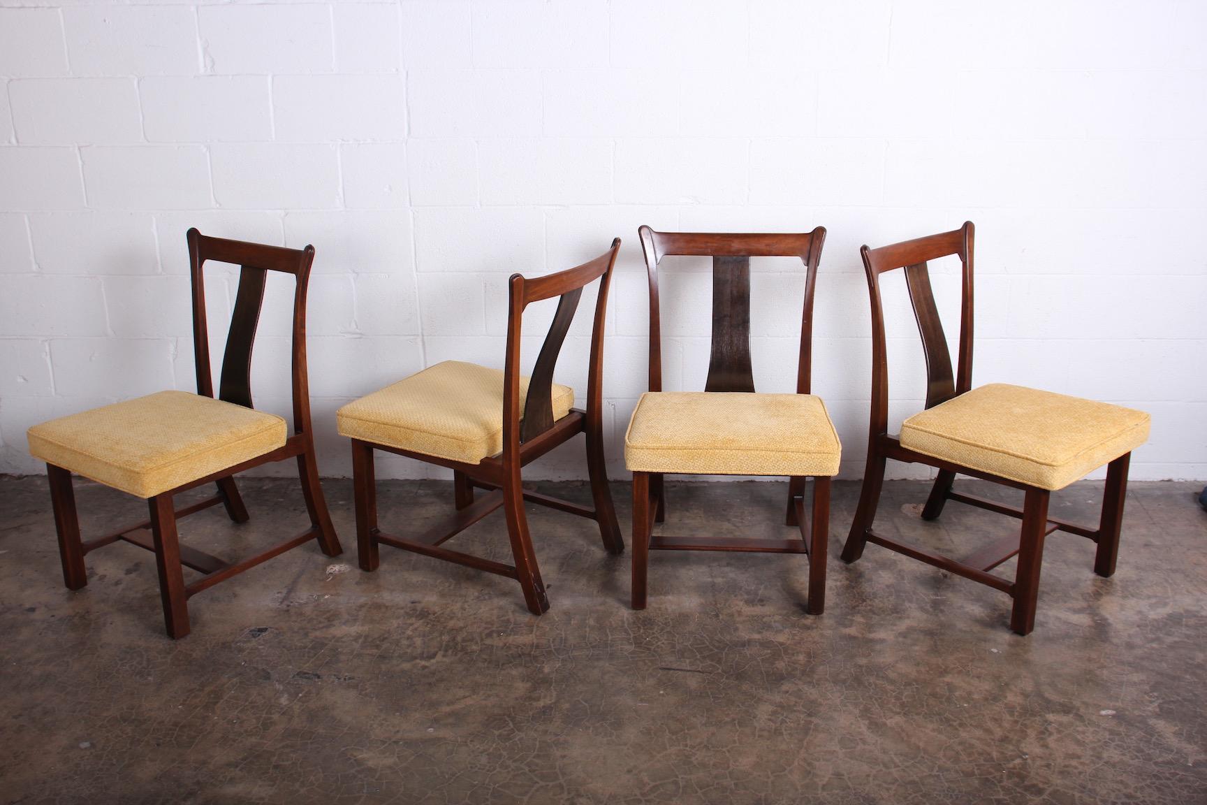 A rare set of four dining / game chairs from the Janus collection known as the Greene & Greene chairs for their crafted details. Designed by Edward Wormley for Dunbar.