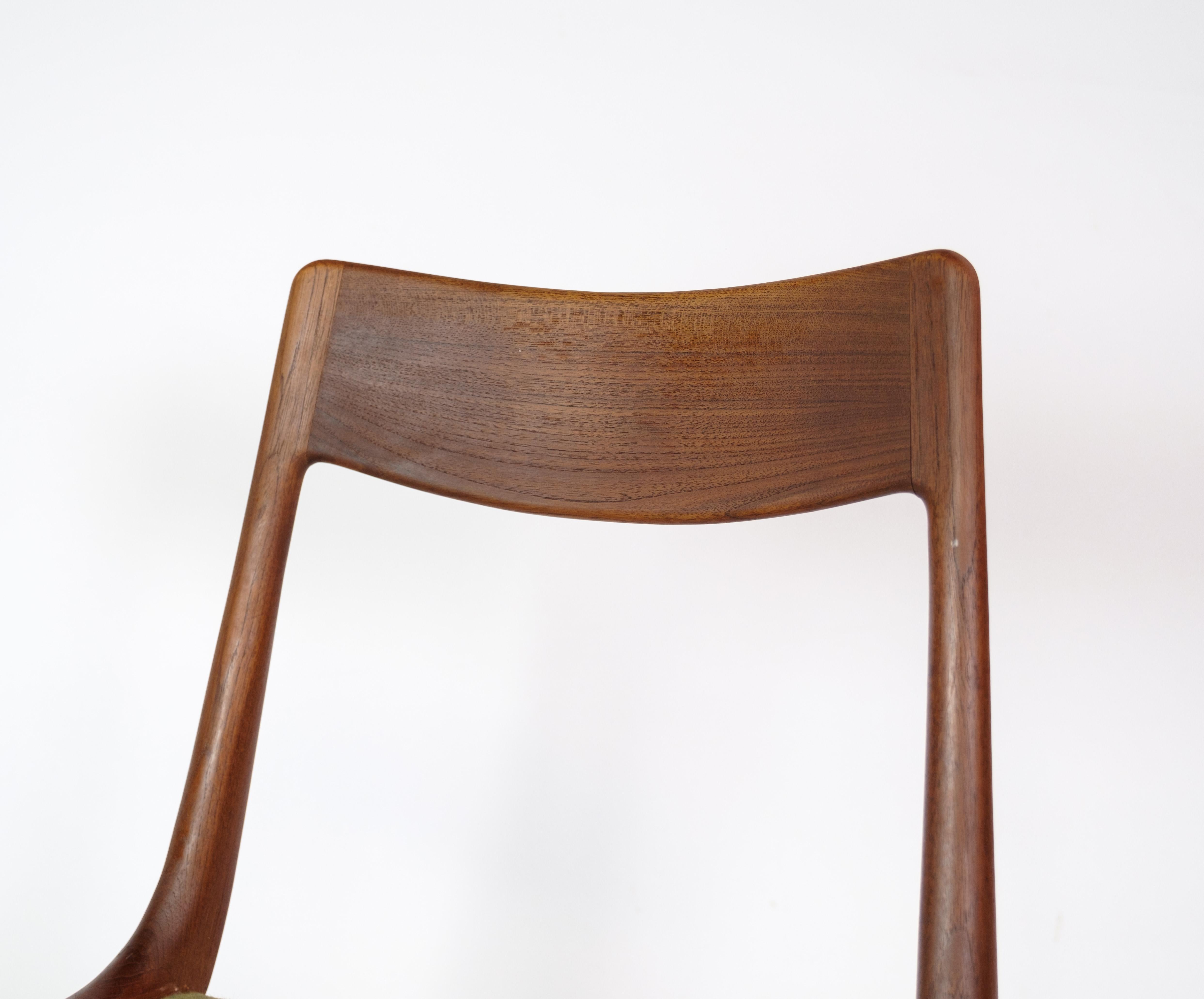 Set of four dining room chairs, Model Boomerang, designed by Alfred Christensen in teak wood manufactured by Slagelse Møbelfabrik in the 1960s. The chairs are made of solid teak with a seat of green striped fabric. Appears in incredibly beautiful