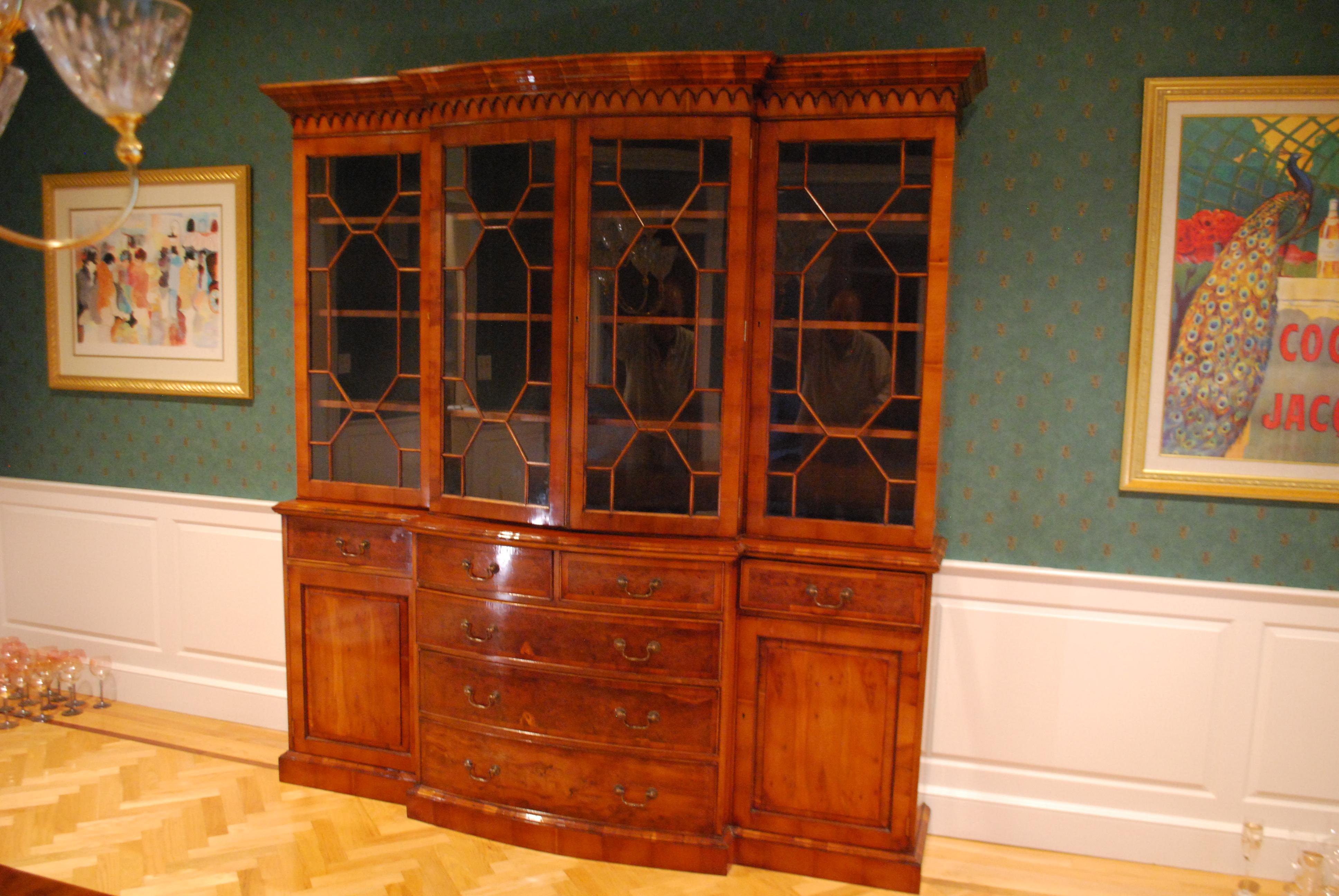 A four-door breakfront cabinet by Mill House Antiques - Reproductions, made in Yew, 1992. 
Measures: 85 1/2