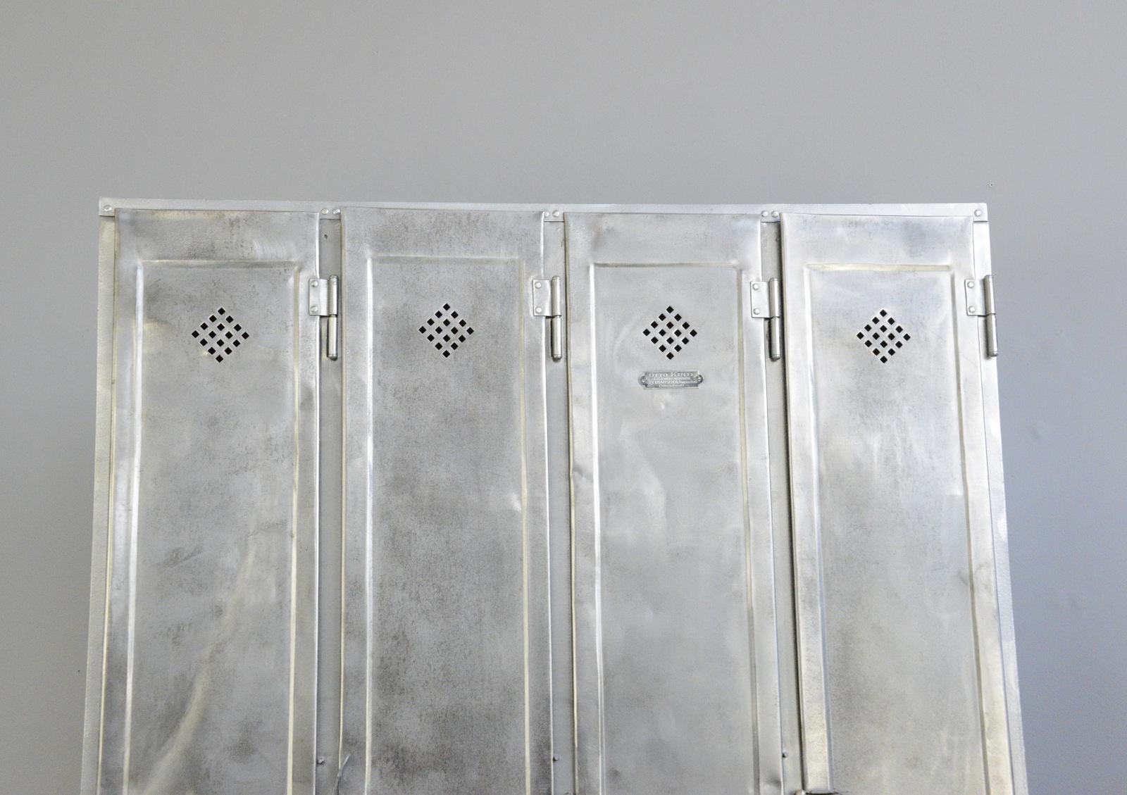 Four door industrial lockers by Otto Kind, circa 1920s

- Made from sheet steel
- Diamond shaped vents
- 4 hanging hooks and 1 shelf in each compartment
- Made by Otto Kind
- German ~ 1920s
- 120cm wide x 33cm deep x 175cm tall

Condition