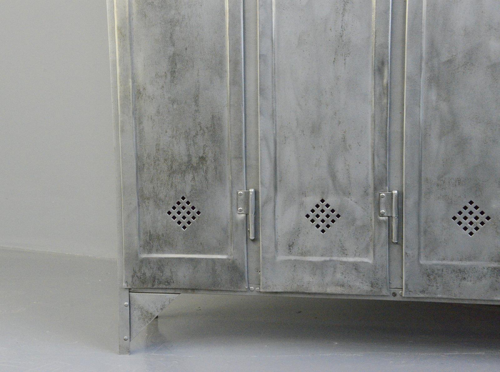 Four-door industrial lockers by Otto Kind, circa 1920s

- Made from sheet steel
- Diamond shaped vents
- 4 hanging hooks and 1 shelf in each compartment
- Made by Otto Kind
- German, 1920s
- Measures: 120cm wide x 33cm deep x 175cm