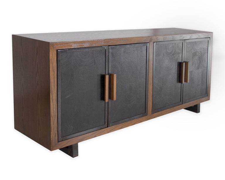 Four door server in oak with a bombay finish, demos ebonized oak doors, and ebony patina. 

Part of our custom line, Vision and Design exclusive to Brendan Bass.