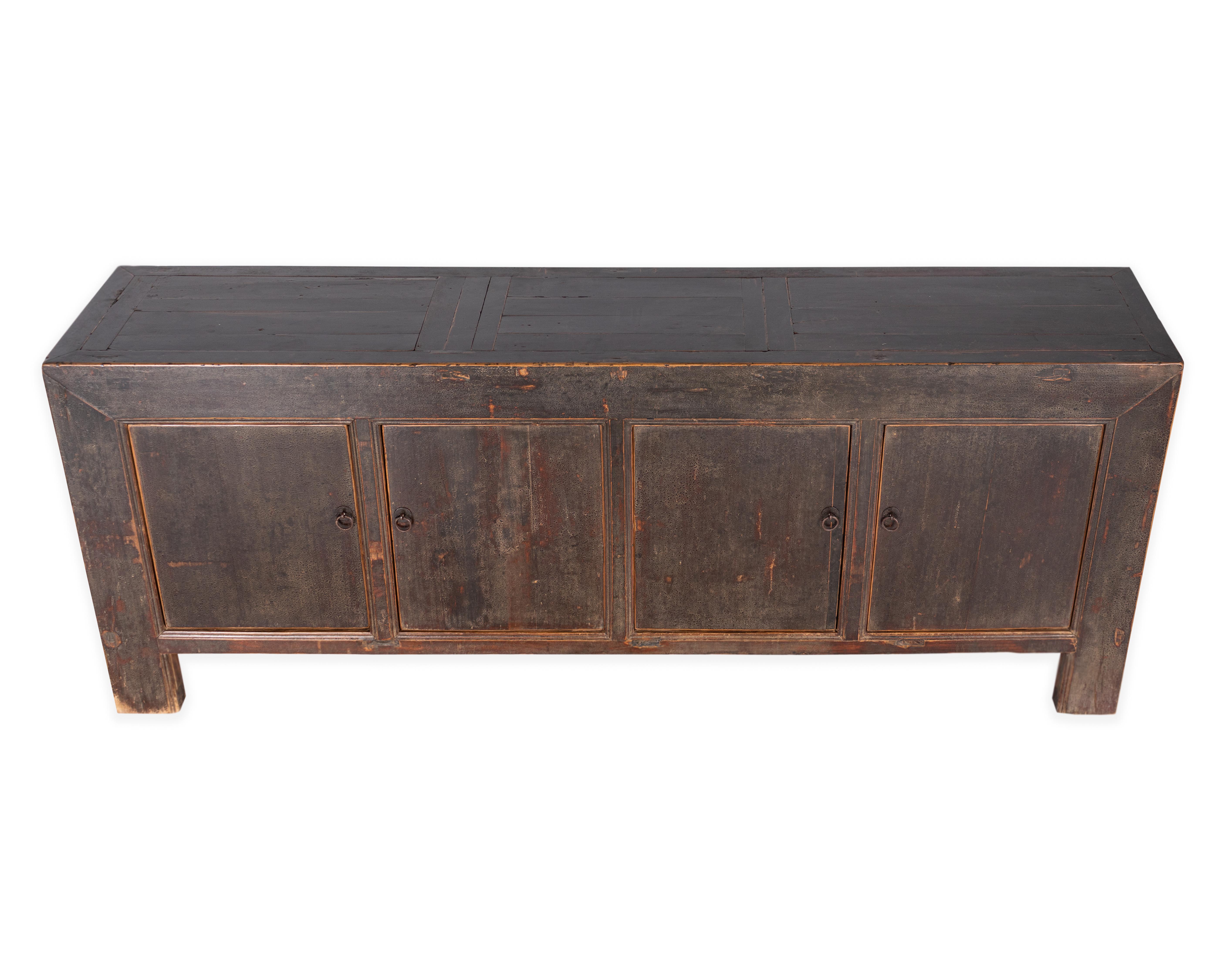 Four door server credenza in original crackle black paint patina. Made from distressed reclaimed elm wood. In my organic, contemporary, vintage and mid-century modern aesthetic.

Piece from the Le Monde collection. Exclusive to Brendan Bass.
 