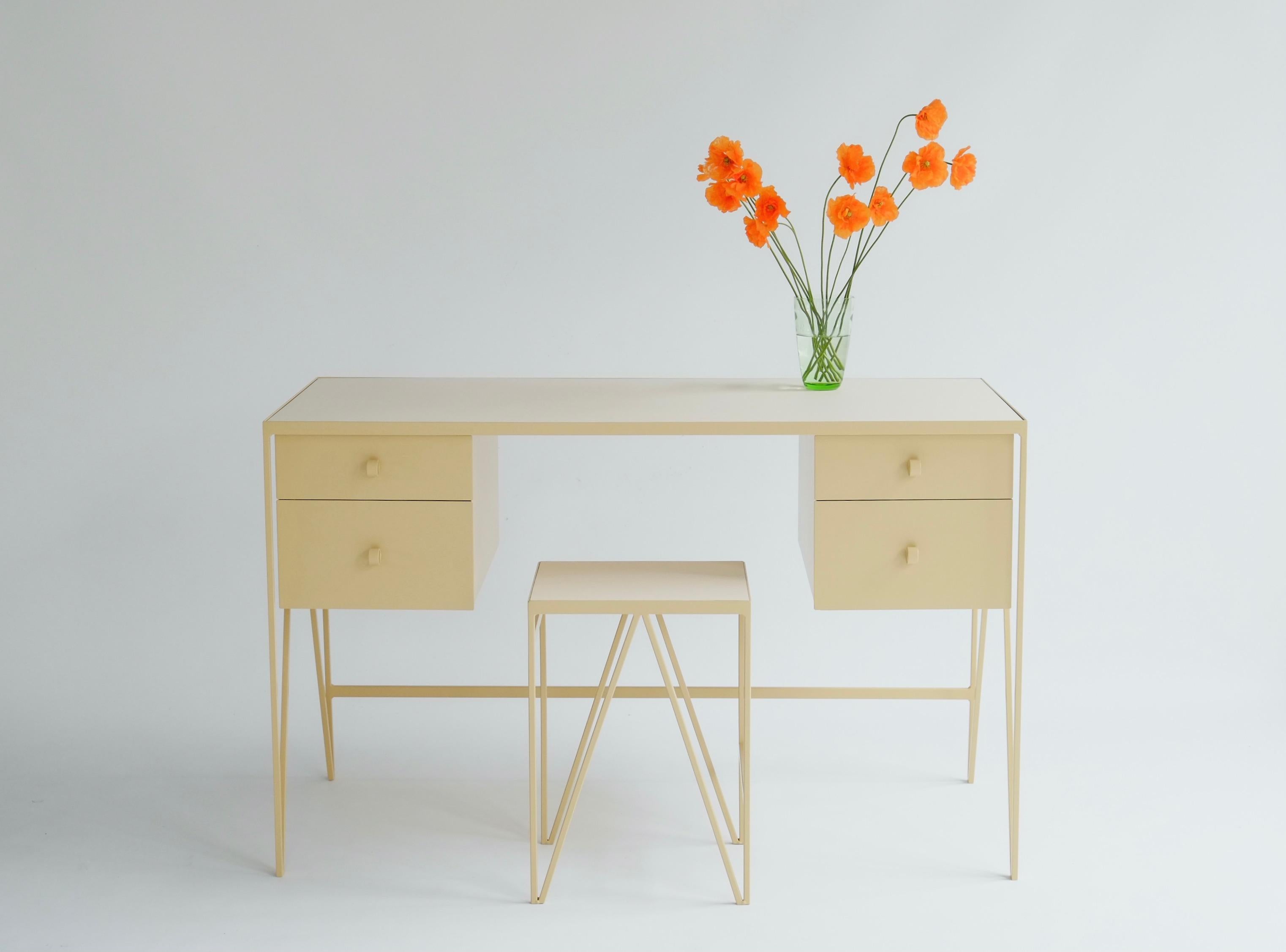 The four-drawer Study desk is made with a butternut powder-coated steel frame and a pearl-coloured natural linoleum tabletop. The linoleum for our desks is selected for the ecological properties of the linseed of which it is made. It also has a