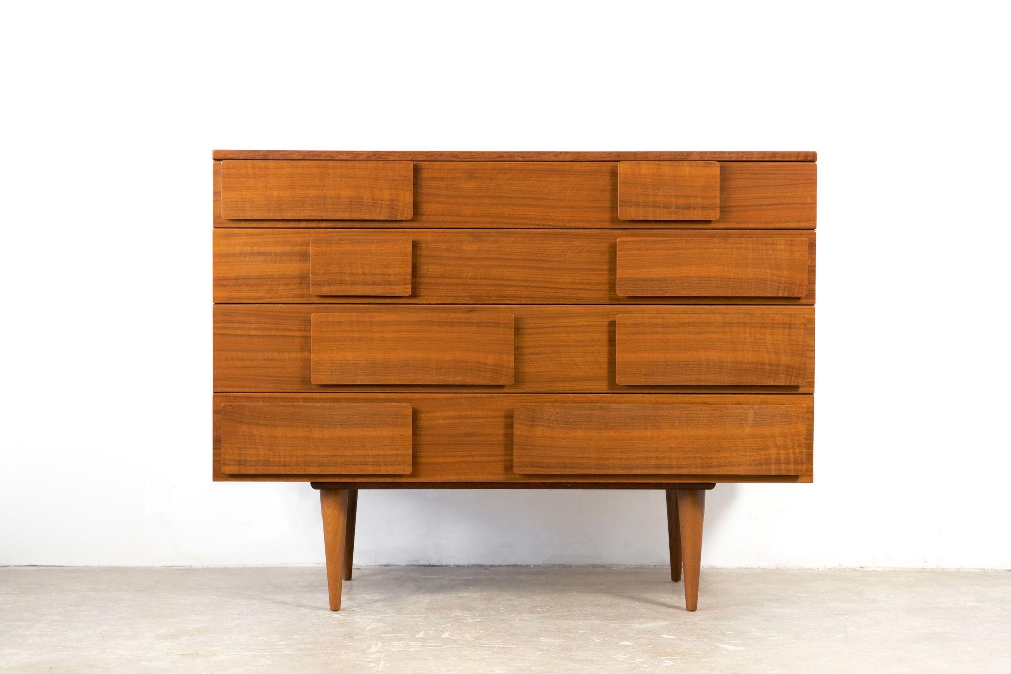 Beautiful crafted four-drawer dresser by Gio Ponti, model 2129 for Singer & Sons, Italy / USA. Dresser is in excellent restored condition constructed from Italian walnut c. 1950.