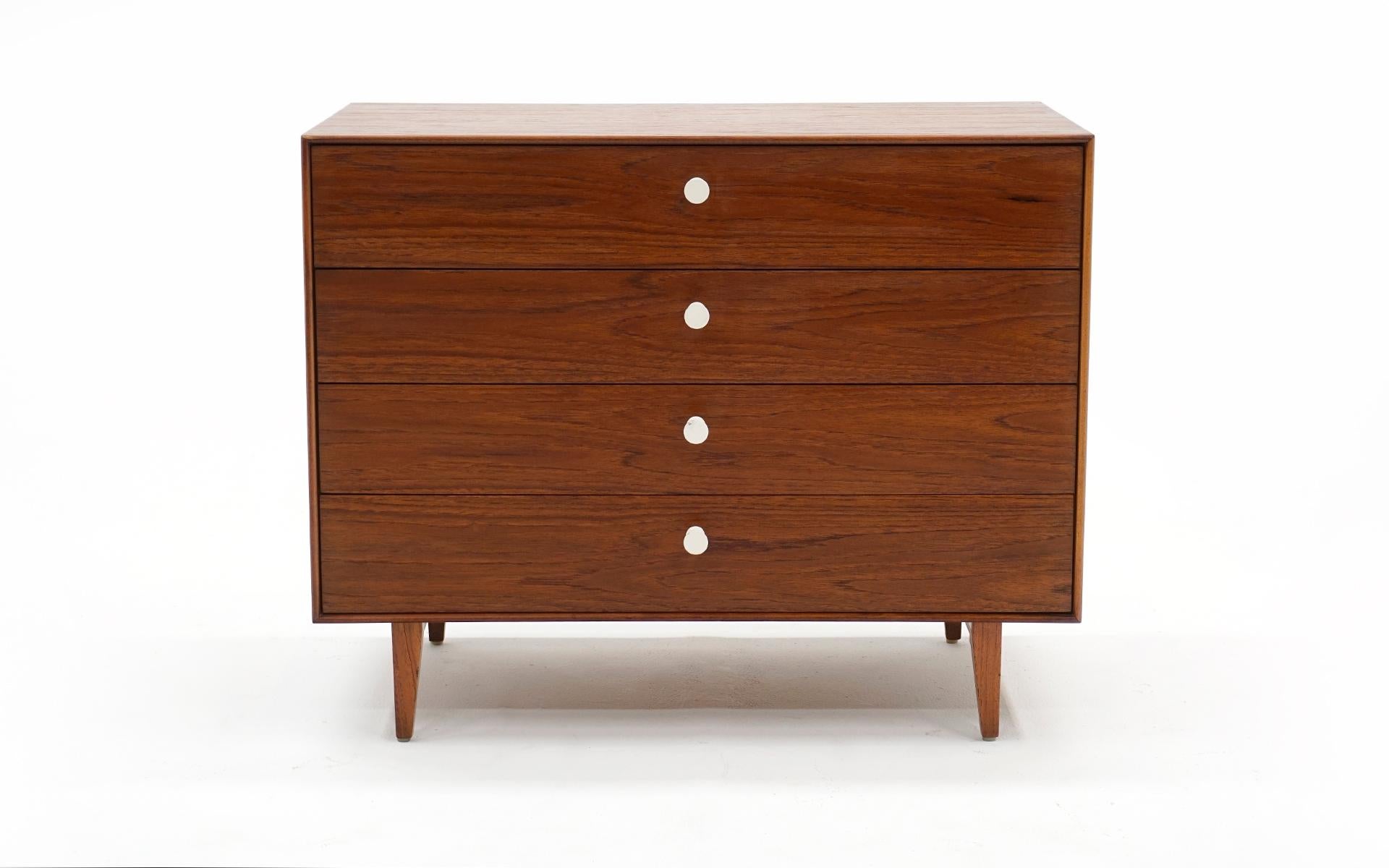 George Nelson Thin Edge cabinet in Brazilian Rosewood, manufactured by Herman Miller. Signed with the early round Herman Miller medallion. Very good original condition. Very few signs of use. As seen in the photos the top back corner has a round