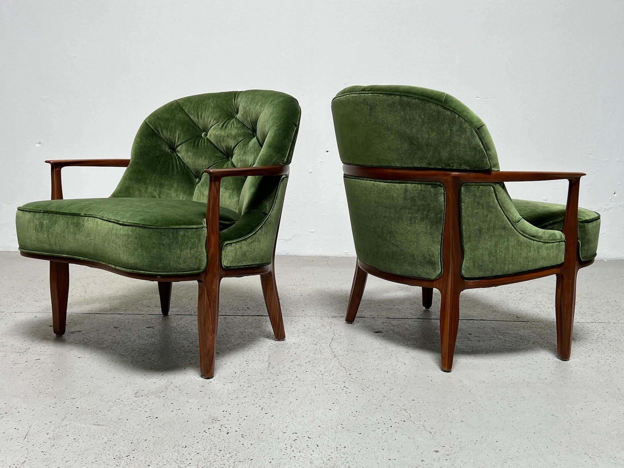 A beautifully restored set of four matching Janus lounge chairs with walnut frames and green velvet upholstery. Designed by Edward Wormley for Dunbar.