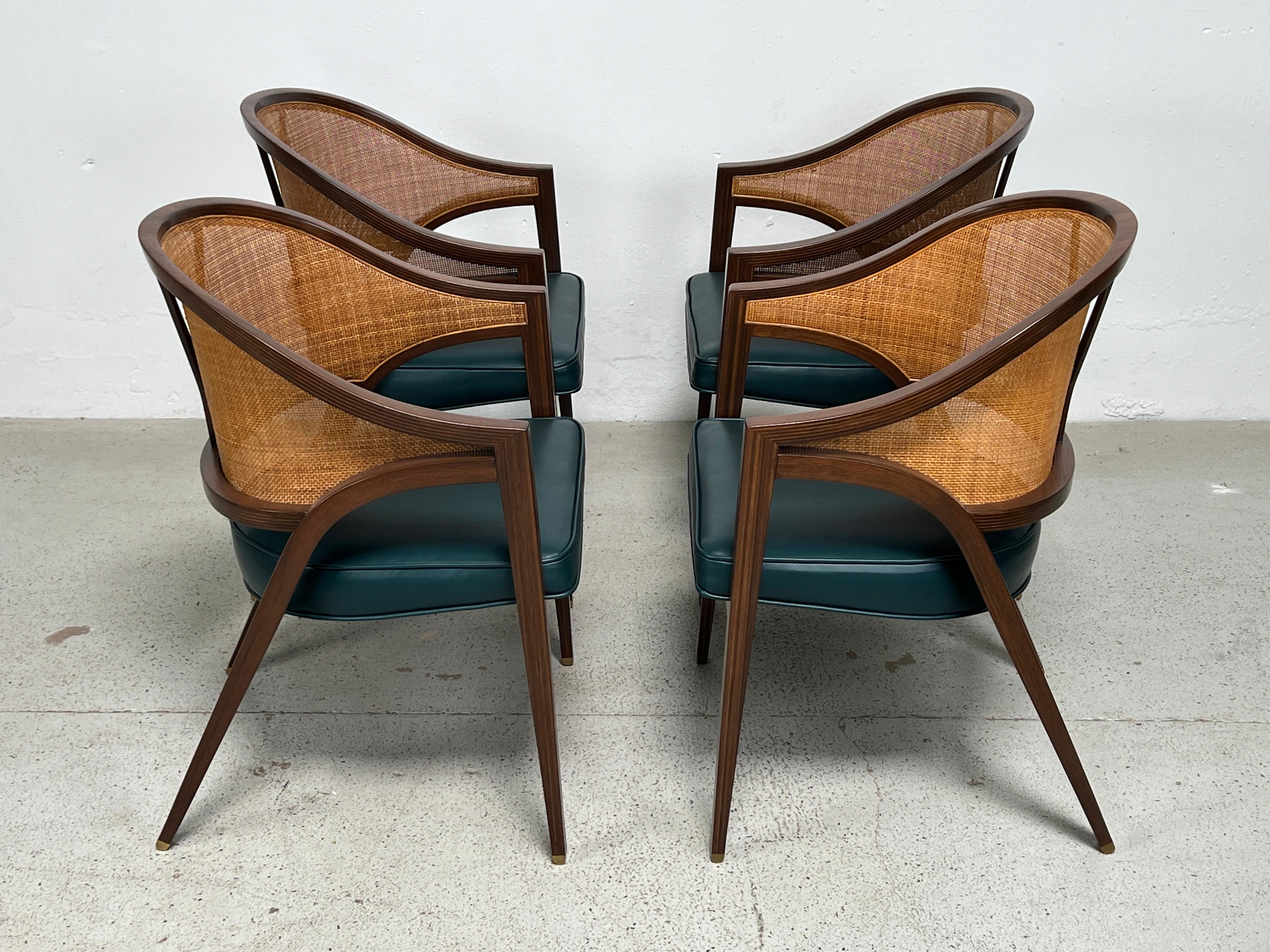 A set of four Y-back chairs in walnut with original cane backs and new leather seats. Designed by Edward Wormley for Dunbar. Fully restored. 
