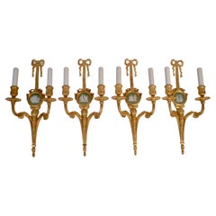 Four E. F. Caldwell Louis XVI Style Gilt Bronze Sconces with Wedgwood Plaques