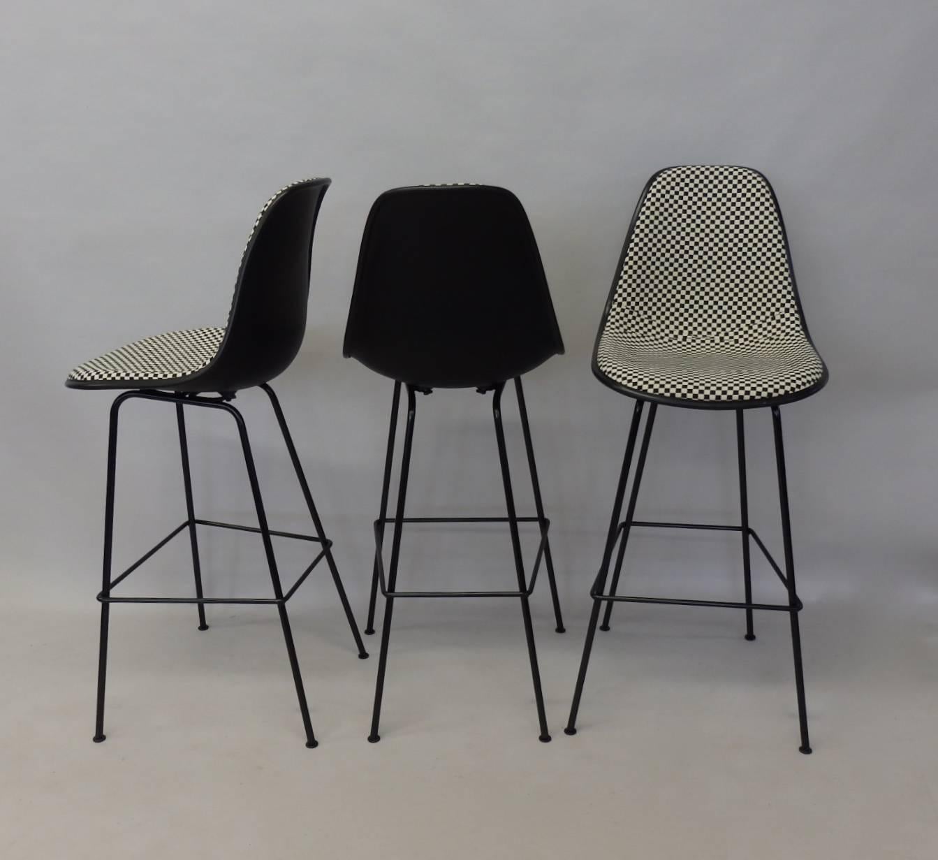 Excellent and basically brand new Eames for Herman Miller barstools. Client bought the set and decided to go in a different direction. I traded them. Never sat in. Wonderful Alexander Girard A grade black and white textile option on the seats.