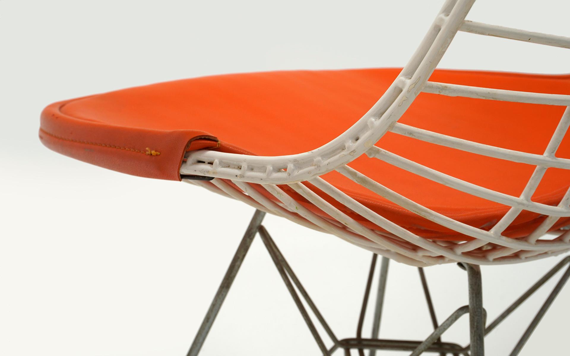 Four Eames White Wire DKR Dining Chairs, Eiffel Tower Base, Orange Bikini Covers 2