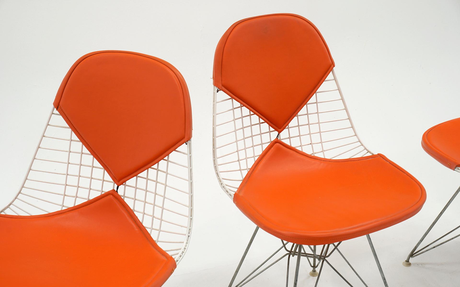 Mid-Century Modern Four Eames White Wire DKR Dining Chairs, Eiffel Tower Base, Orange Bikini Covers