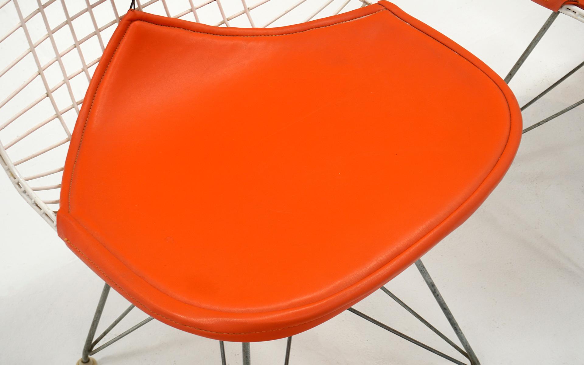 Four Eames White Wire DKR Dining Chairs, Eiffel Tower Base, Orange Bikini Covers In Good Condition In Kansas City, MO