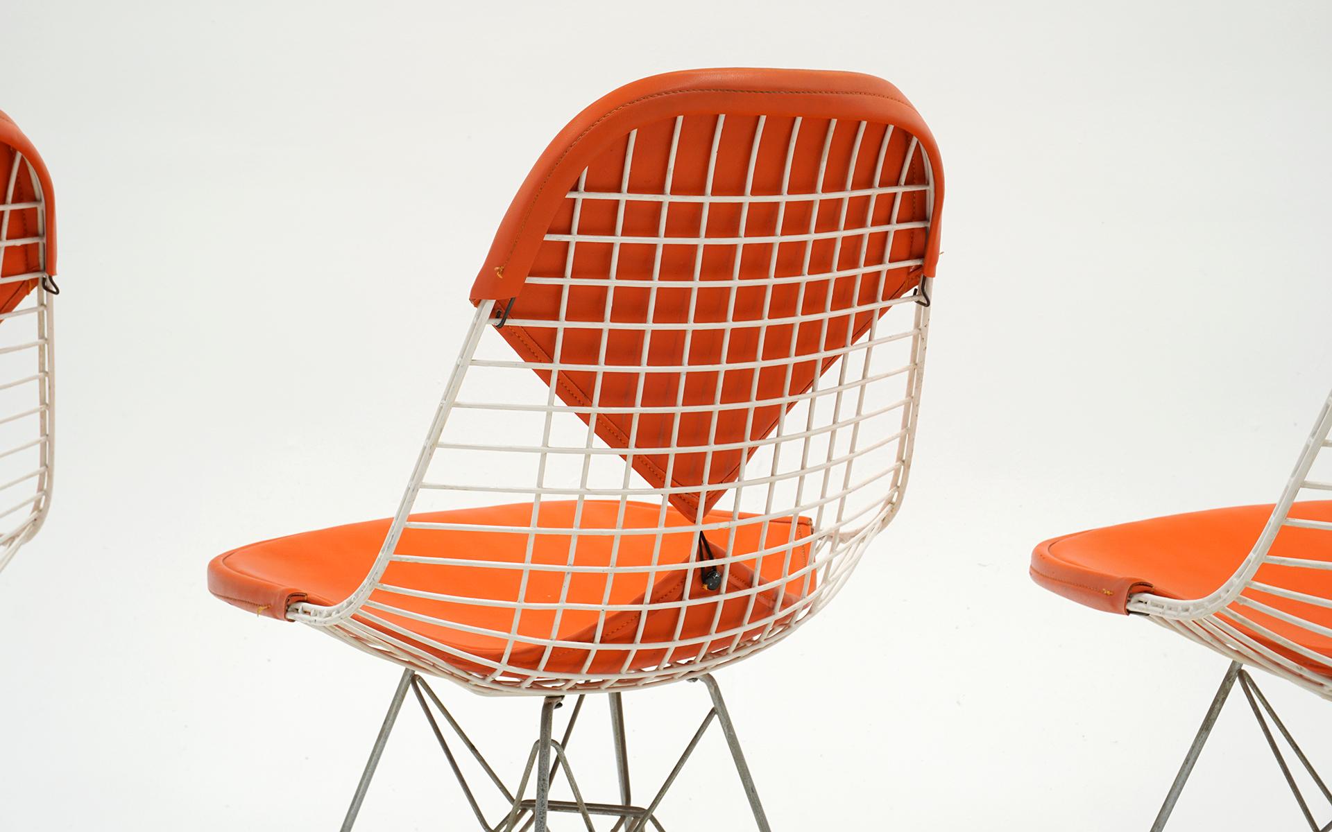 Steel Four Eames White Wire DKR Dining Chairs, Eiffel Tower Base, Orange Bikini Covers