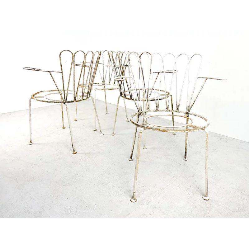 20th Century Set of four Midcentury rustic cast iron garden chairs in white. 