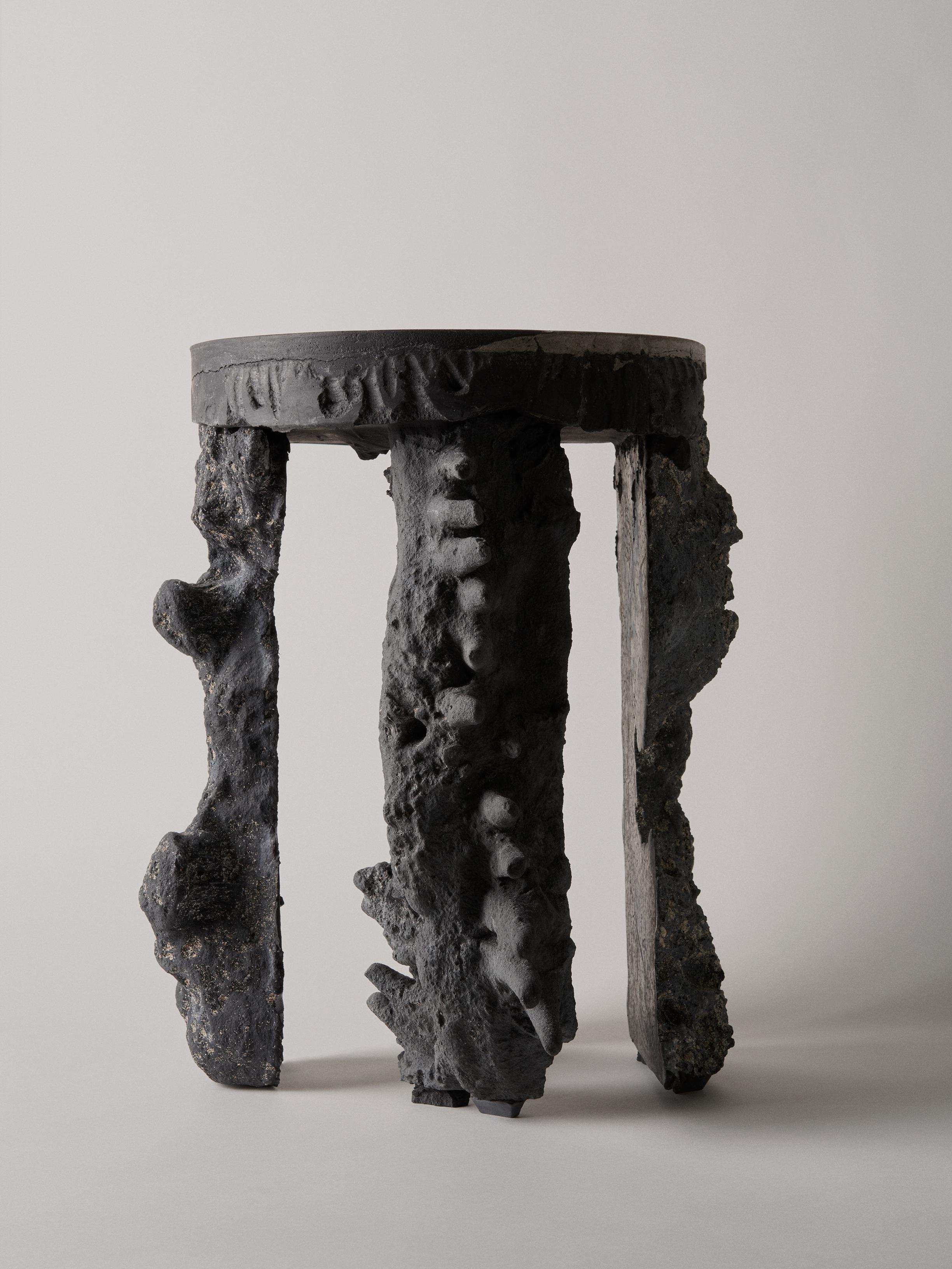Four elements pedestal by Kajsa Melchior
Fictive Erosion collection
Dimensions: H approximate 45 cm
Ø approximaye 35 cm
Materials: Sculpted in sand by pressure from air, water and the human body
Developed in crystal, colored by coal
This piece