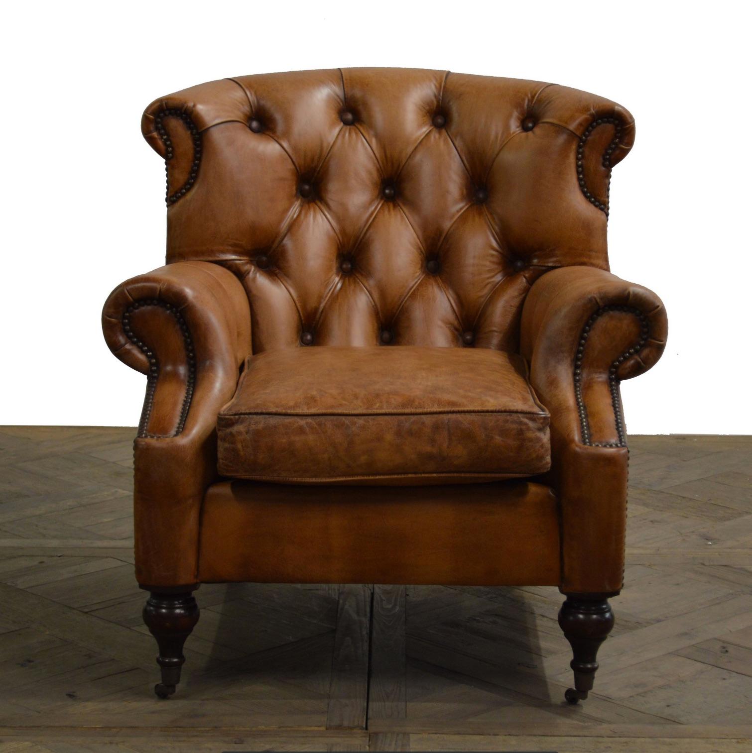 Four English Georgian style club chairs with tufted back, lovely hand worn patina. Great scale for comfort. Priced per chair.