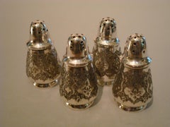 Four Engraved Russian Sterling Silver Salt and Pepper Shakers
