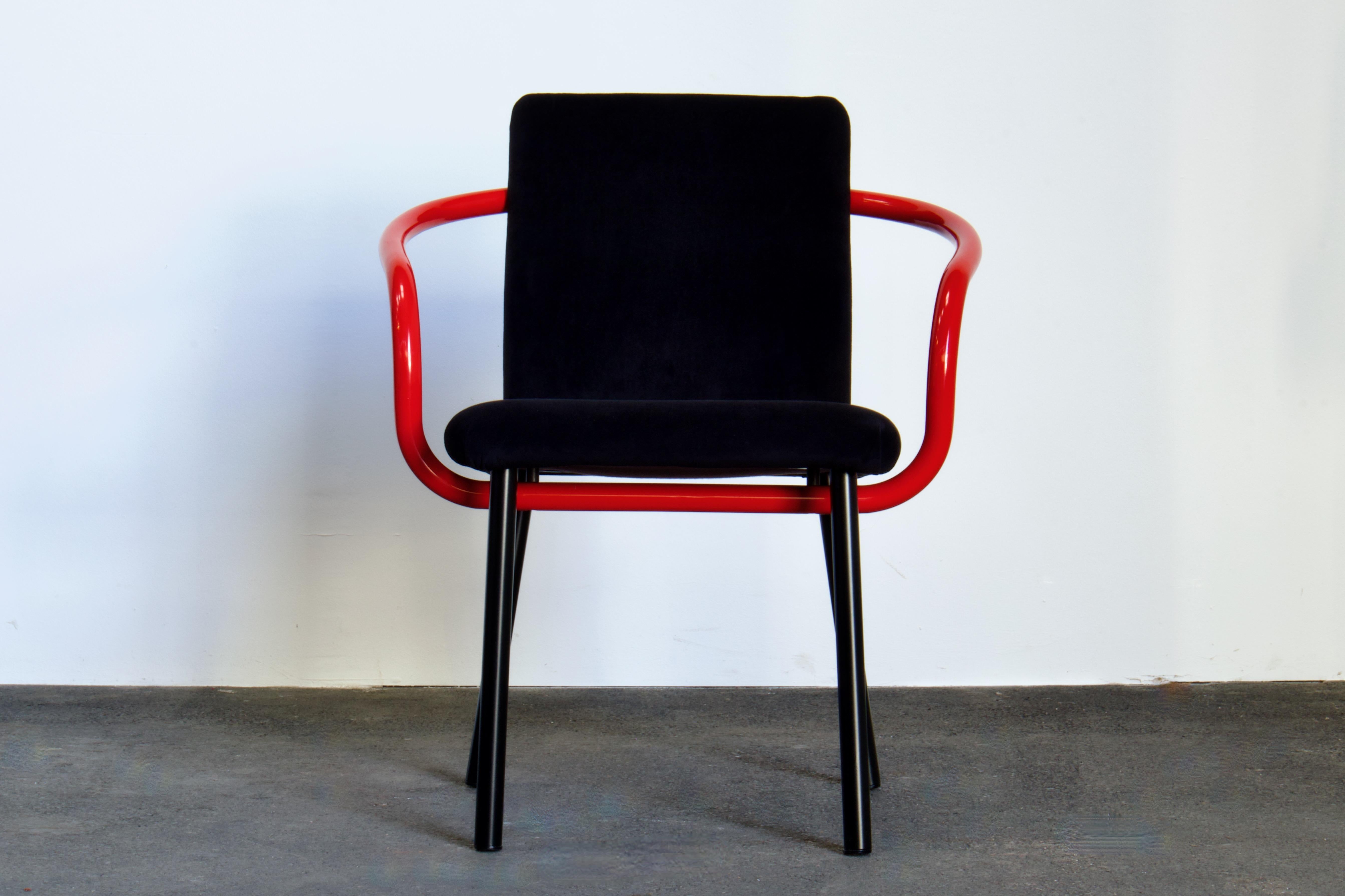 Icon of the Memphis Milano Movement. A set of four Ettore Sottsass Mandarin chairs for Knoll. Black Alcantara upholstery. Arms in red lacquer.

A 1986 design by Ettore Sottsass for Knoll, the Mandarin chair consists of a flat rectangular seat