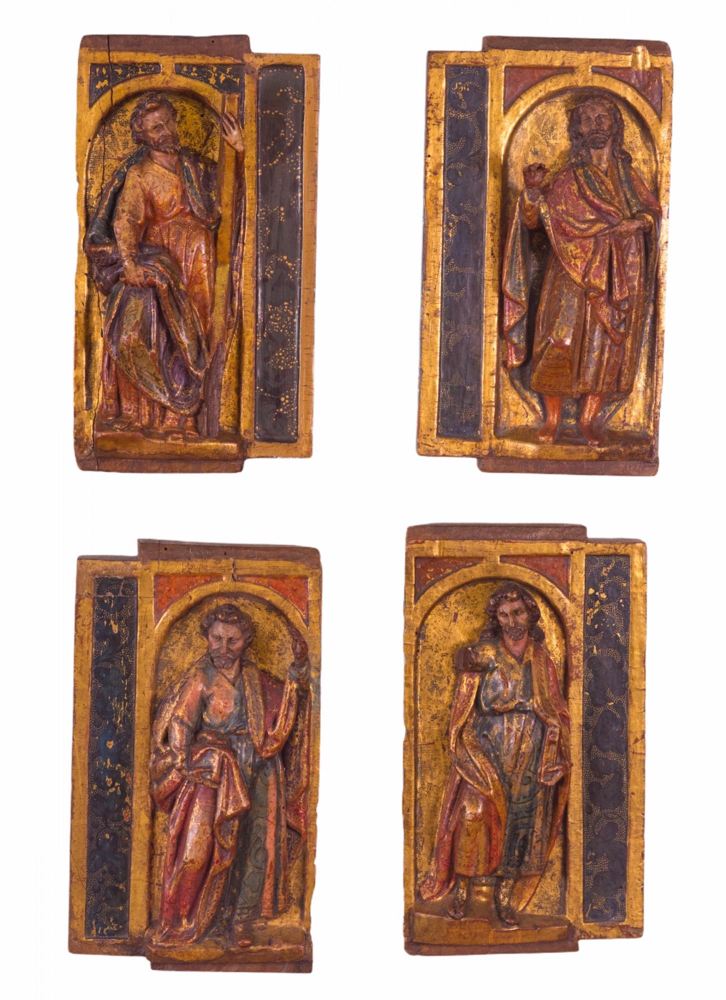 12th Century Spanish (Romanesque Period) gold gilded and polychromed carved-wood plaques of the four Evangelists; Matthew, Mark, Luke, and John, the authors attributed with the creation of the four Gospels in the New Testament. These are mounted on