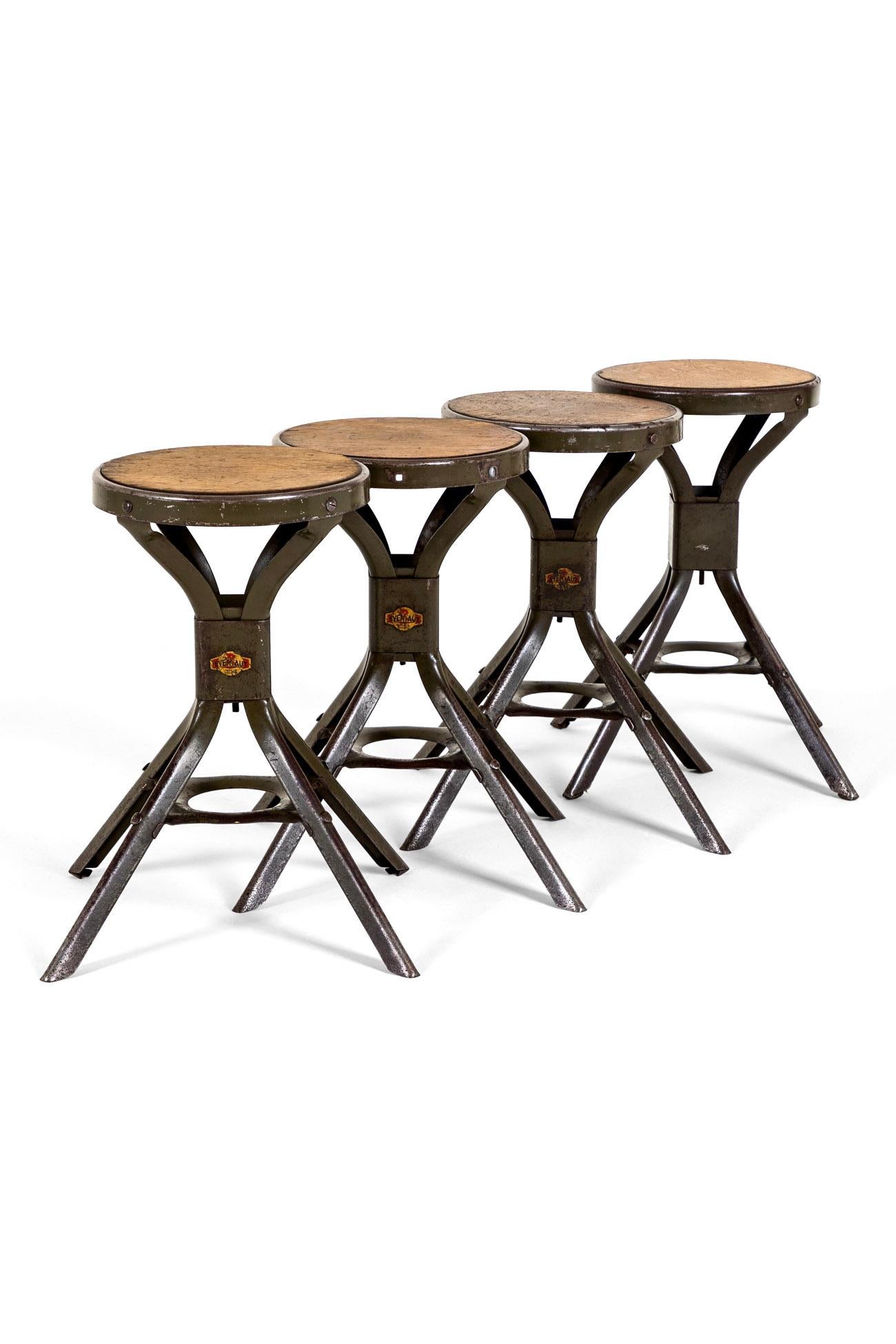 A group of four industrial work stool’s by British seating company Evertaut.

These rarer example’s are smaller than most and each retains the original pitch pine seat and company logo at the base of the four splayed legs.

In original, strong and